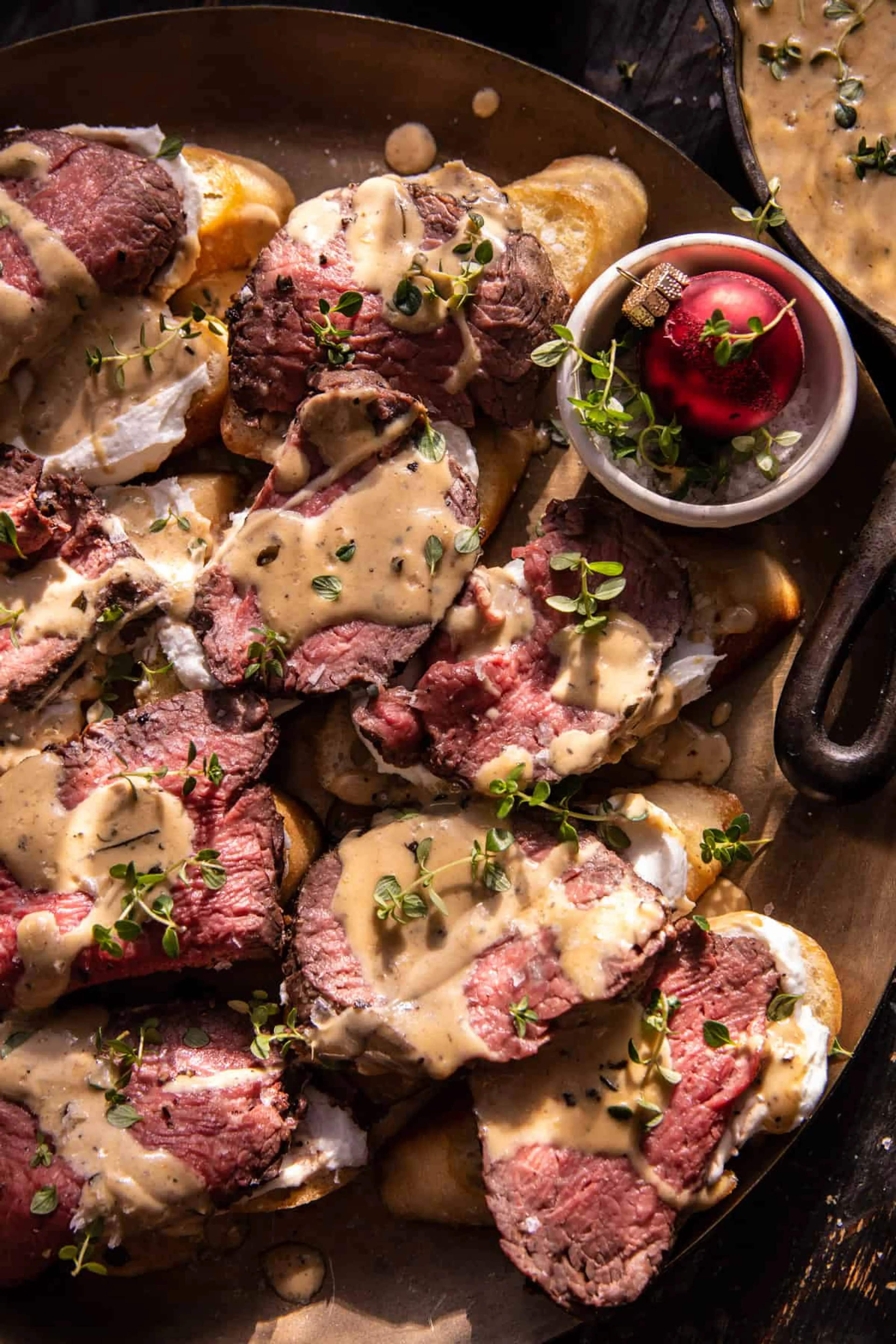 Beef Tenderloin Crostini with Parmesan Wine Cream Sauce