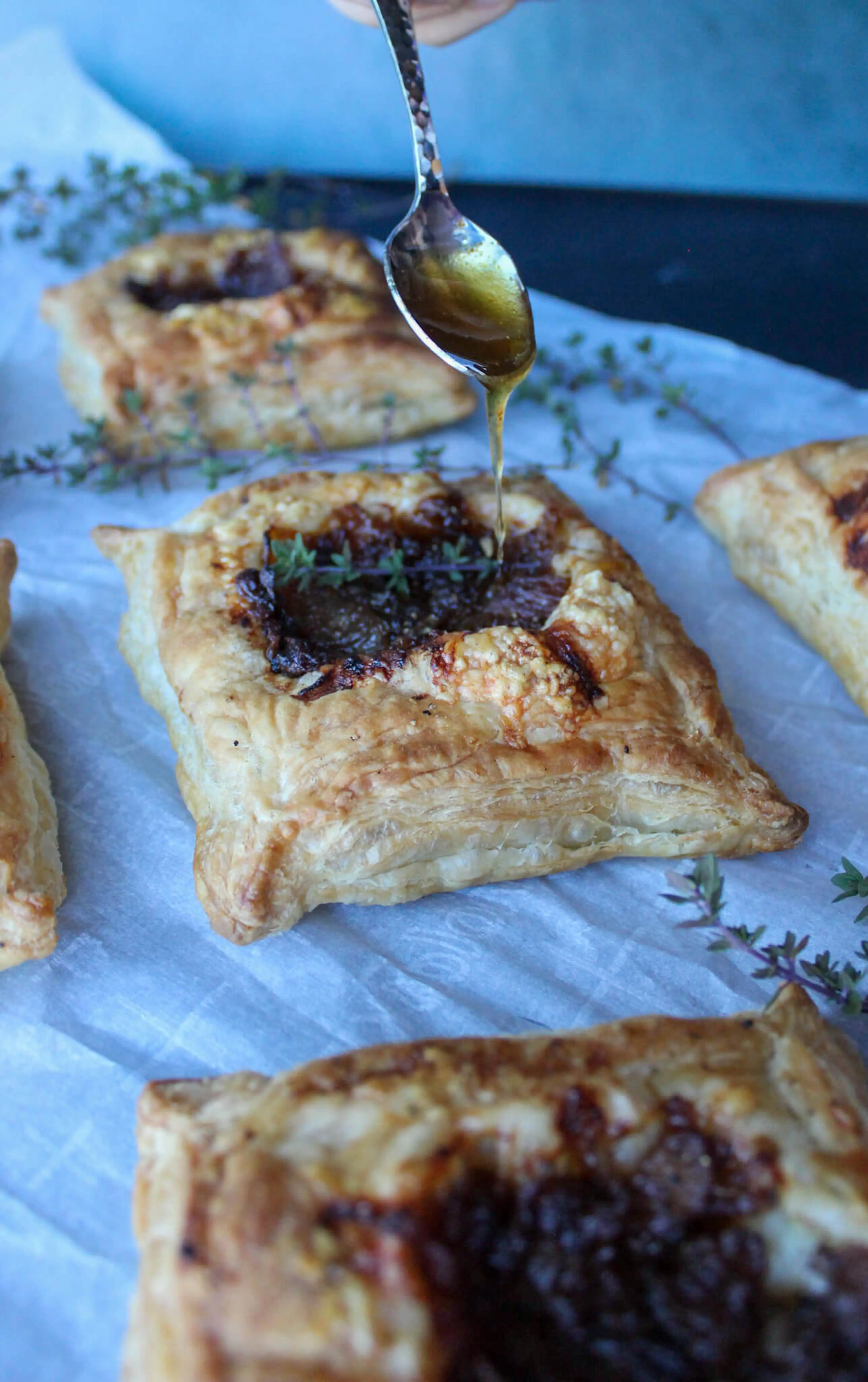 French Onion Puff Pastry Tarts with Hot Honey Drizzle
