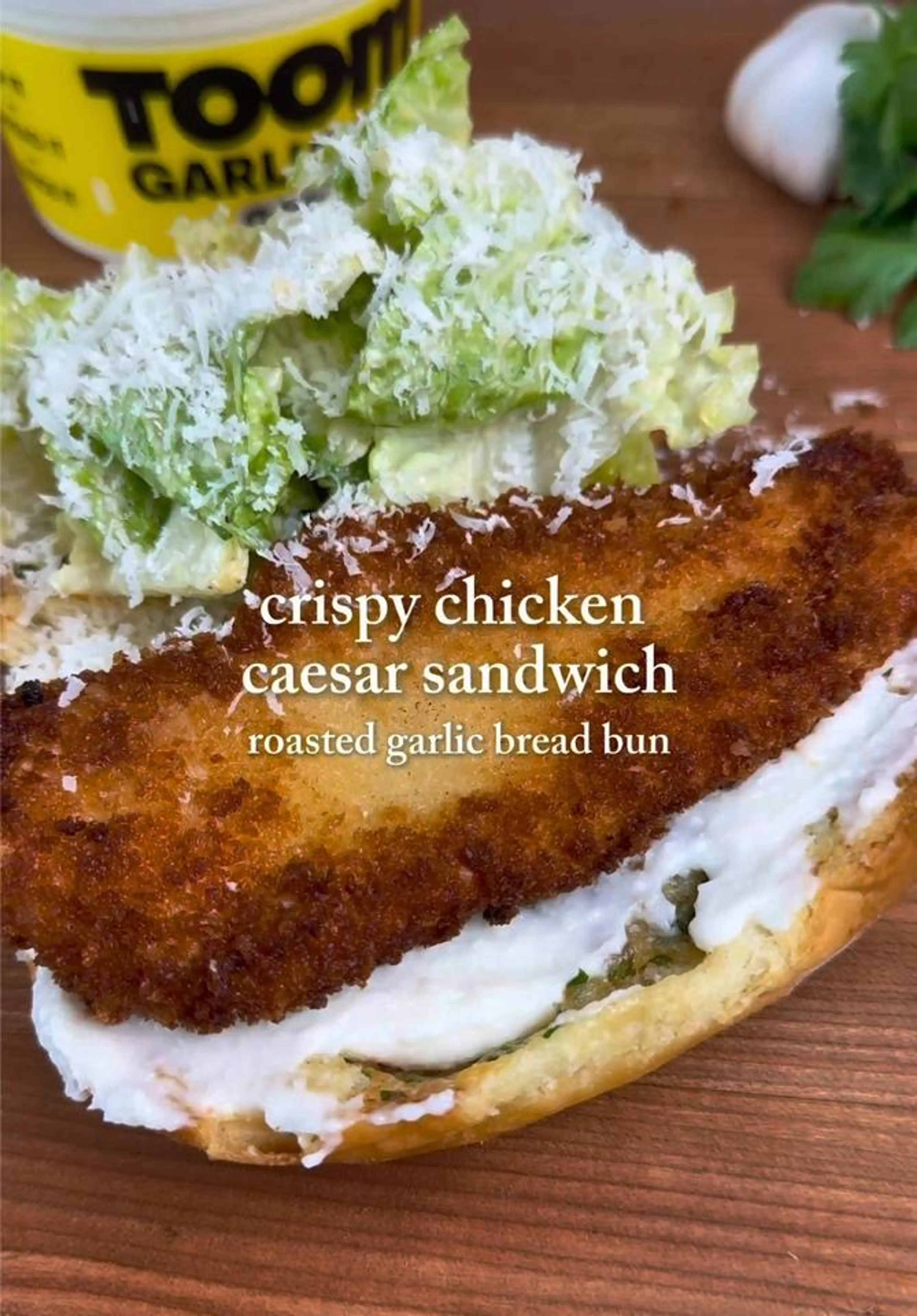 Crispy Chicken Schnitzel Caesar in a Roasted Garlic Bread Bu