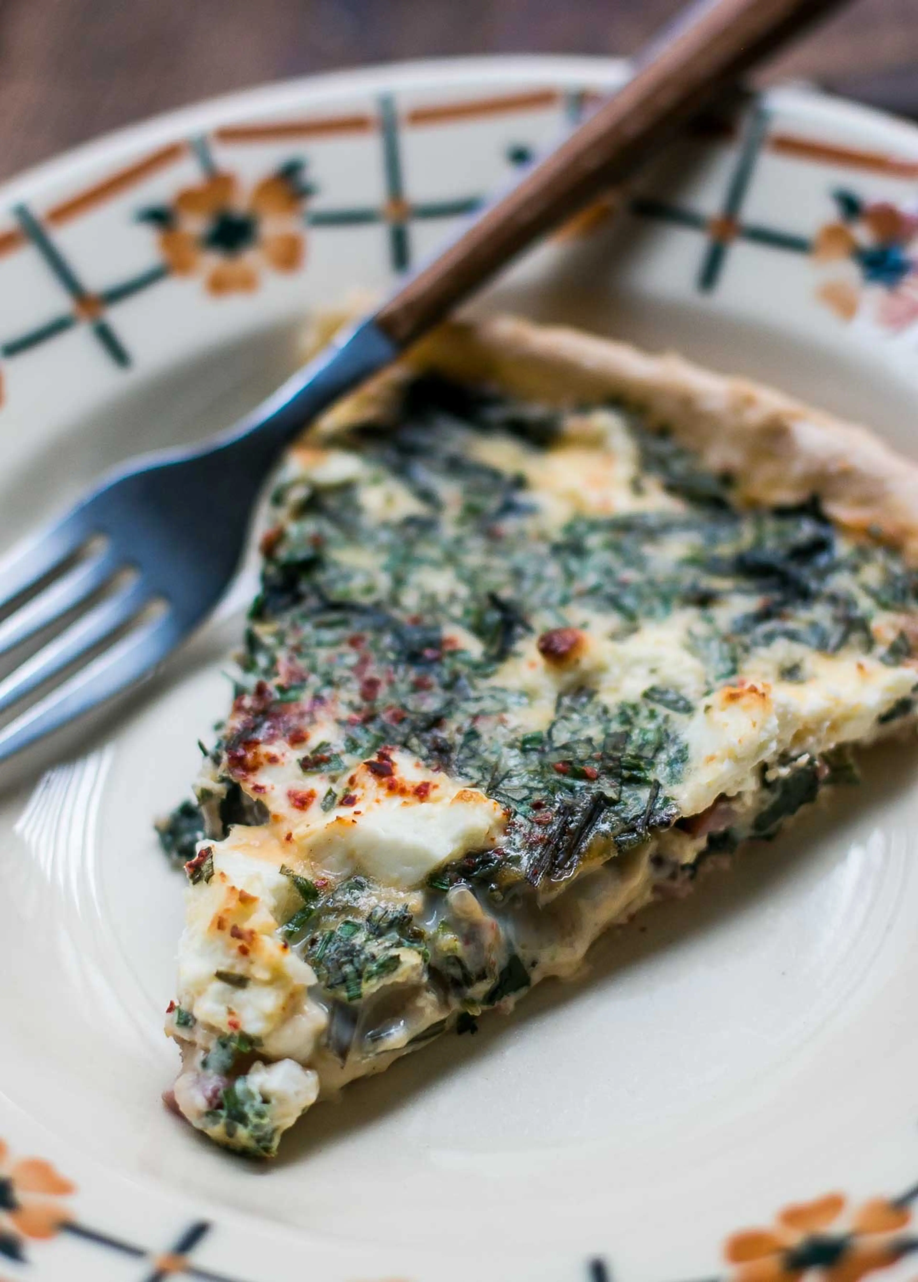 Quiche with greens, bacon and feta