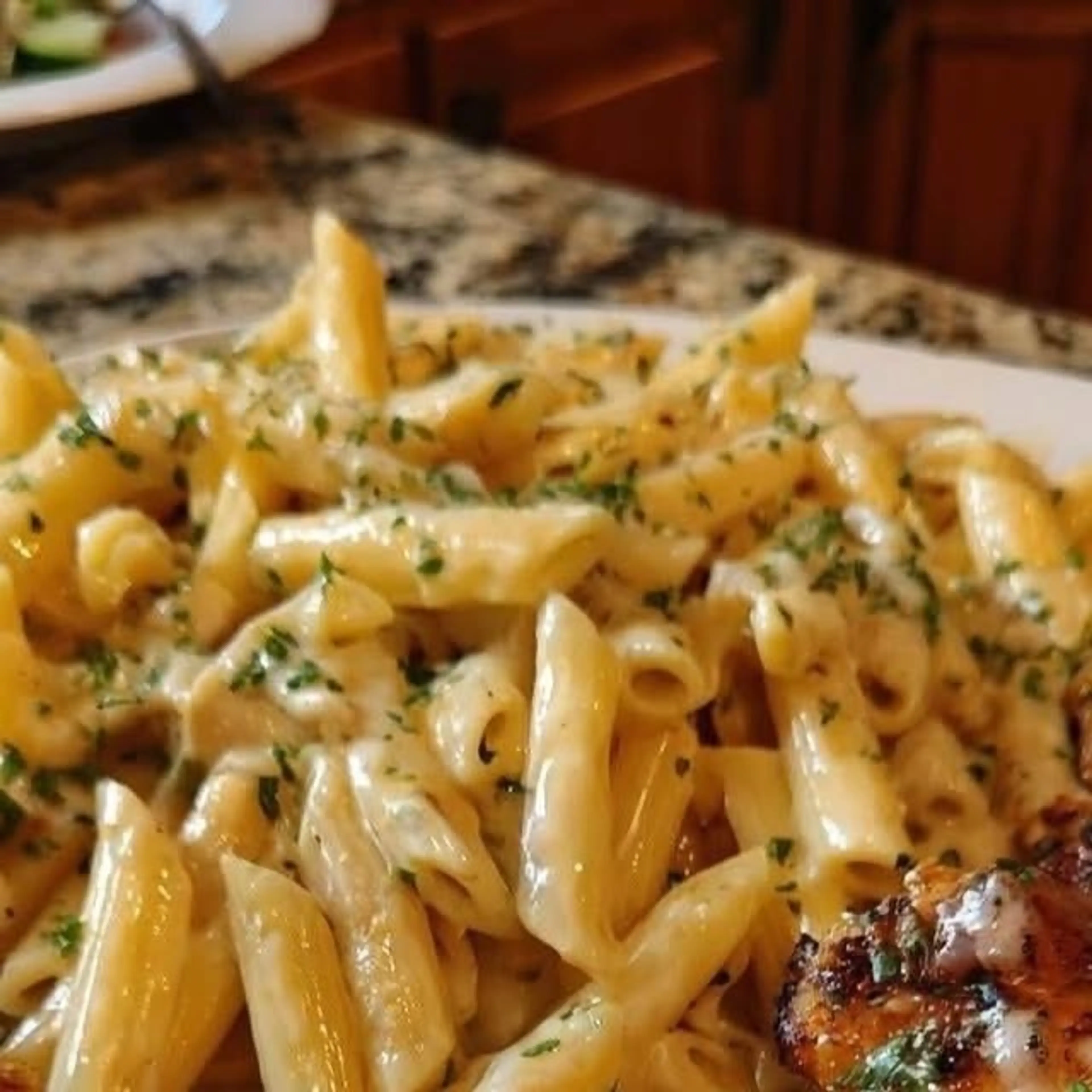 Cheesy Penne and Cajun Chicken in Garlic Parmesan Cream