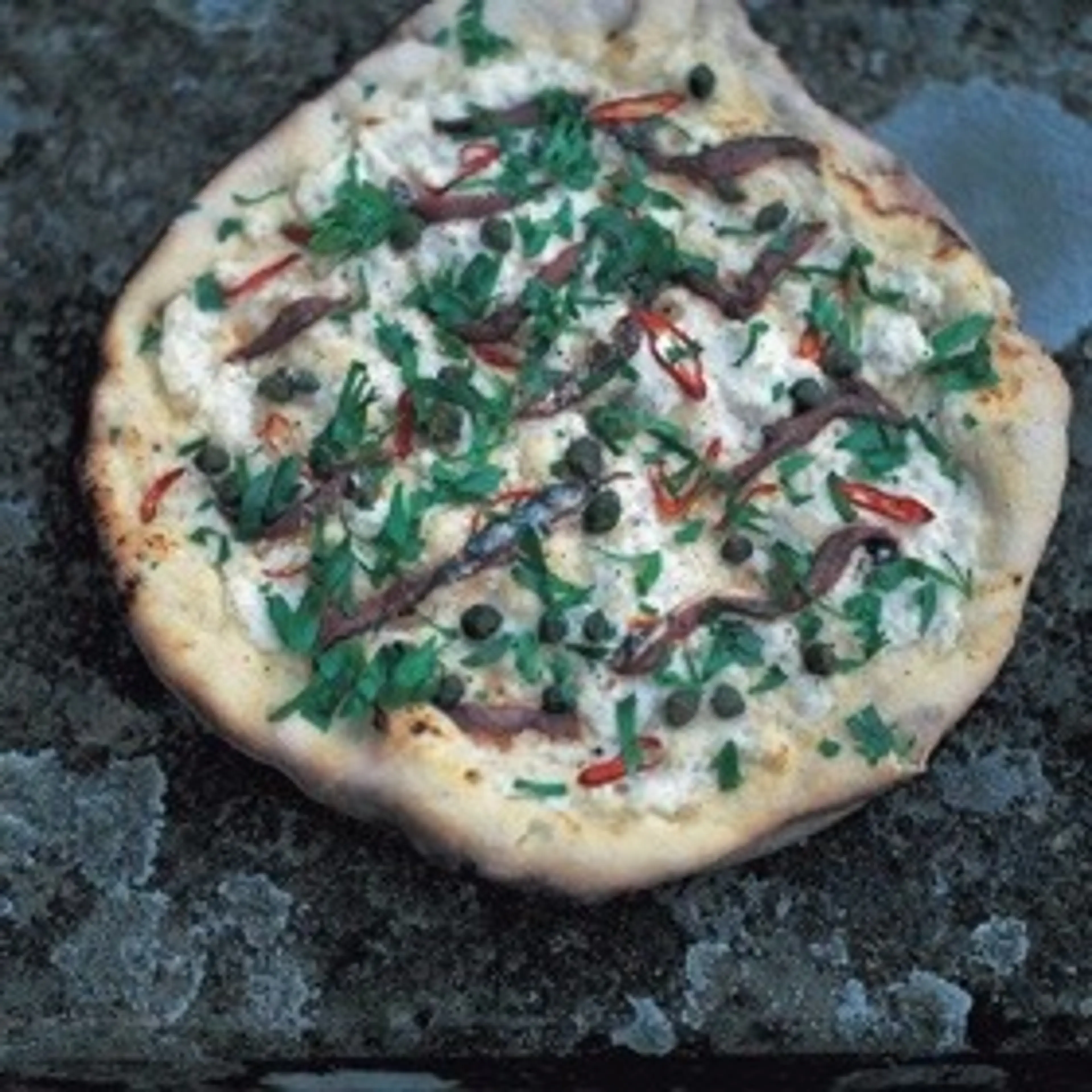 Mozzarella, anchovies, chilli, capers & parsley pizza toppin