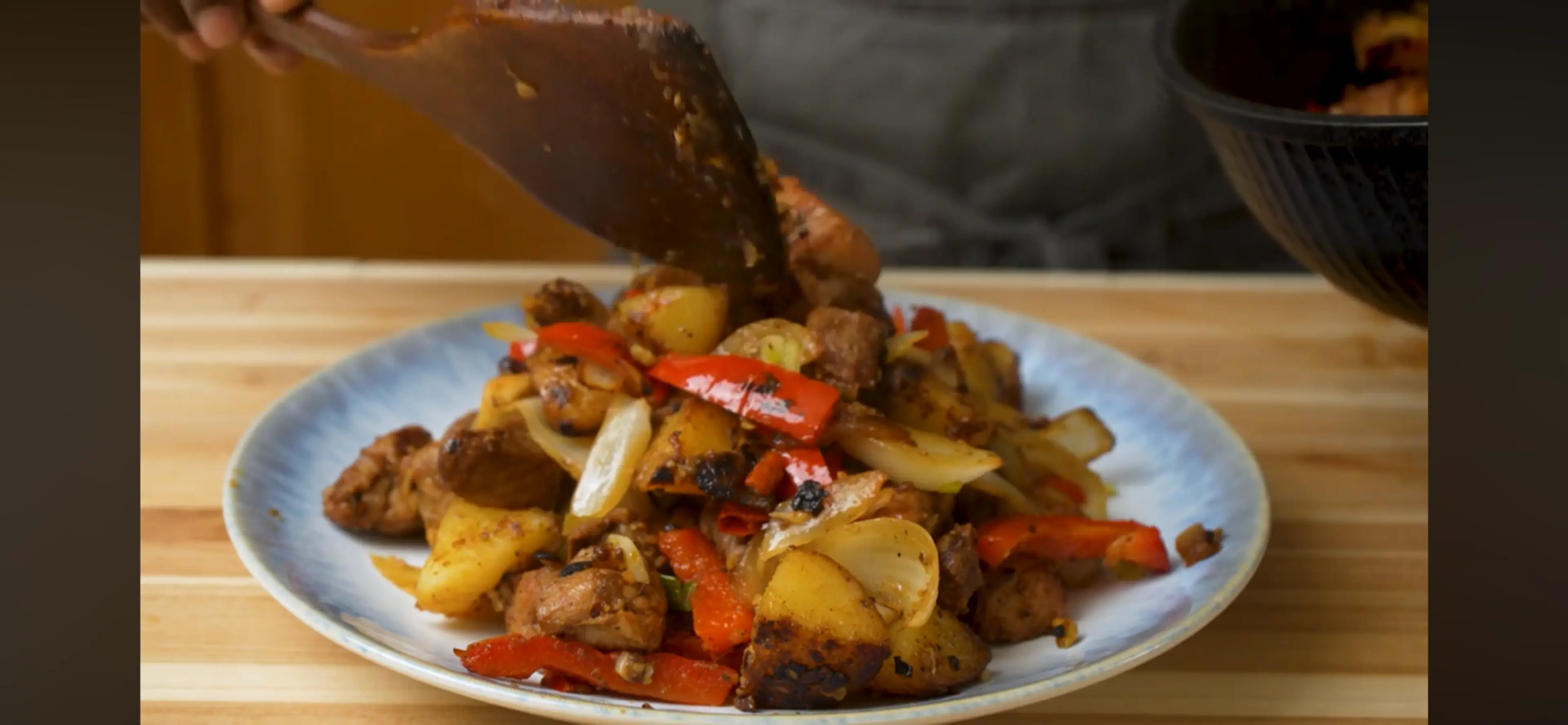 Pork And Potatoes With Peppers And Onions