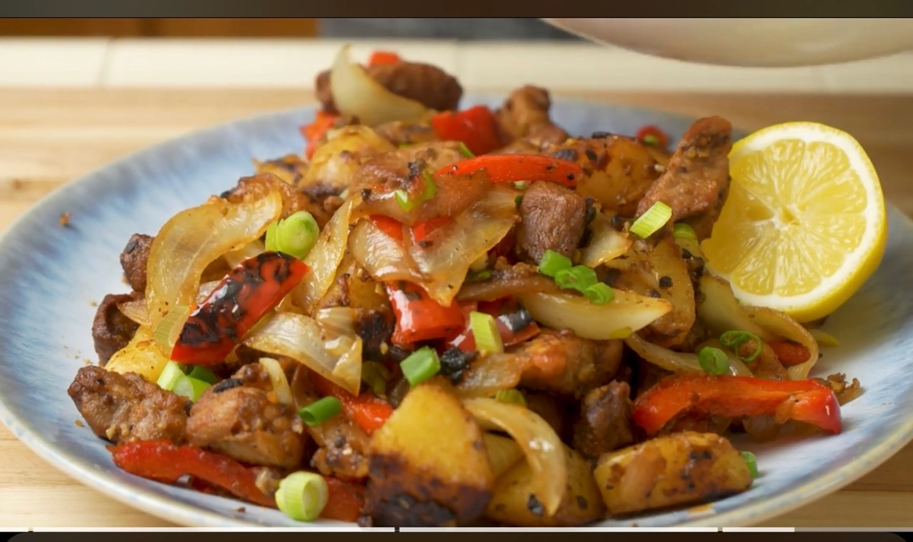Pork And Potatoes With Peppers And Onions