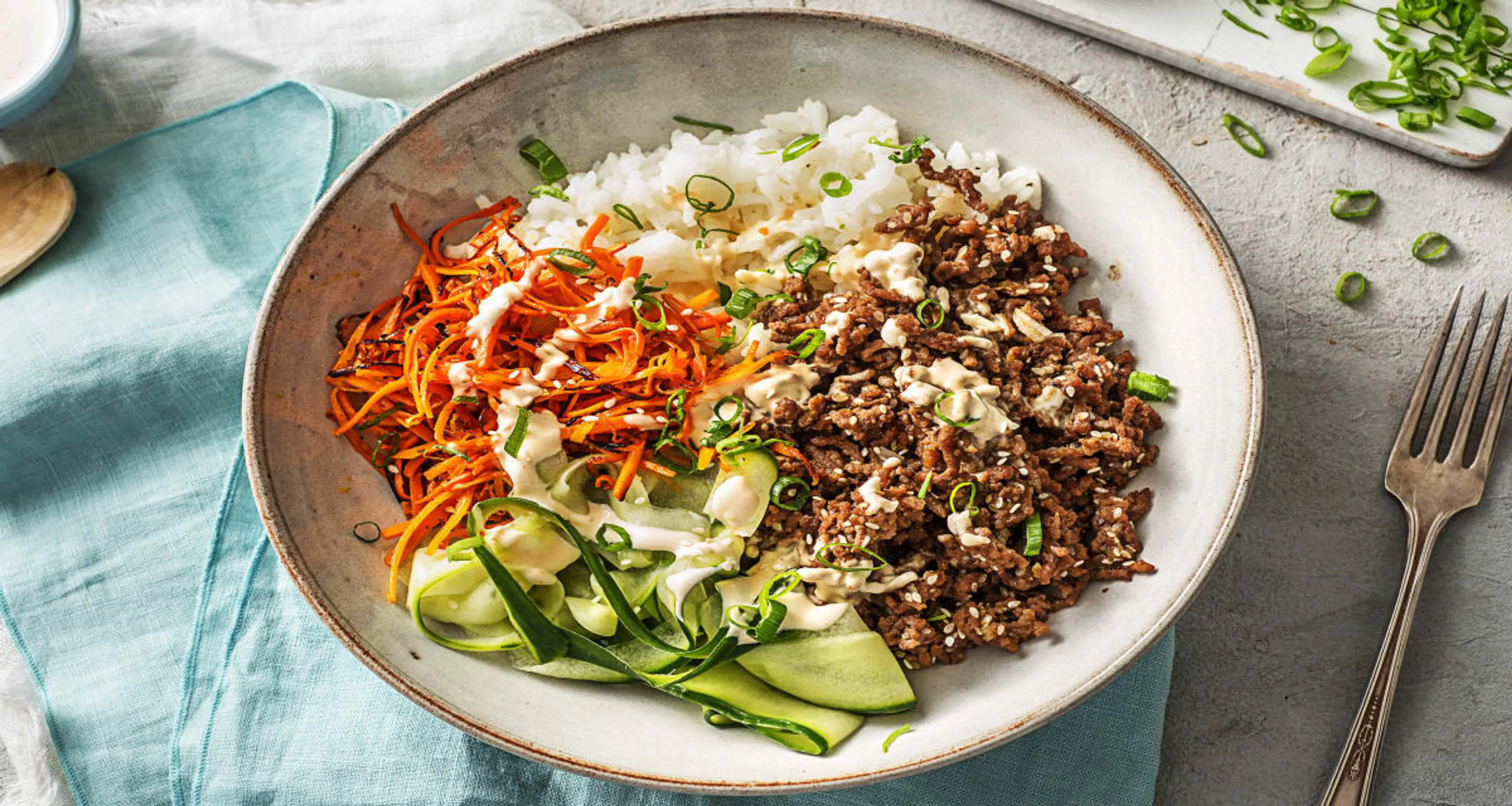 Ground Beef Bulgogi Bowls with Carrots, Cucumber, and Srirac
