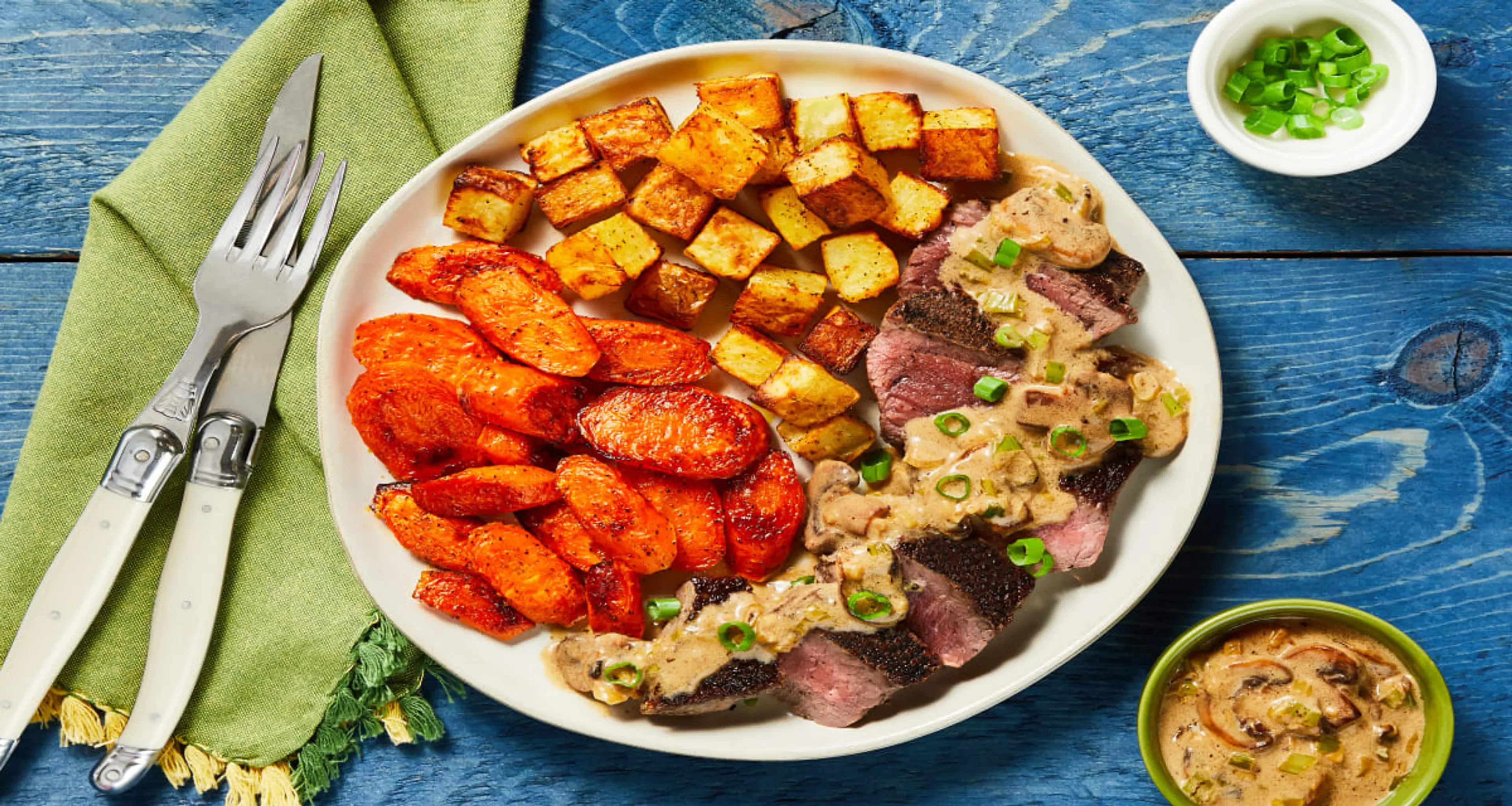 Steak with Mushroom Cream Sauce plus Roasted Potatoes & Carr