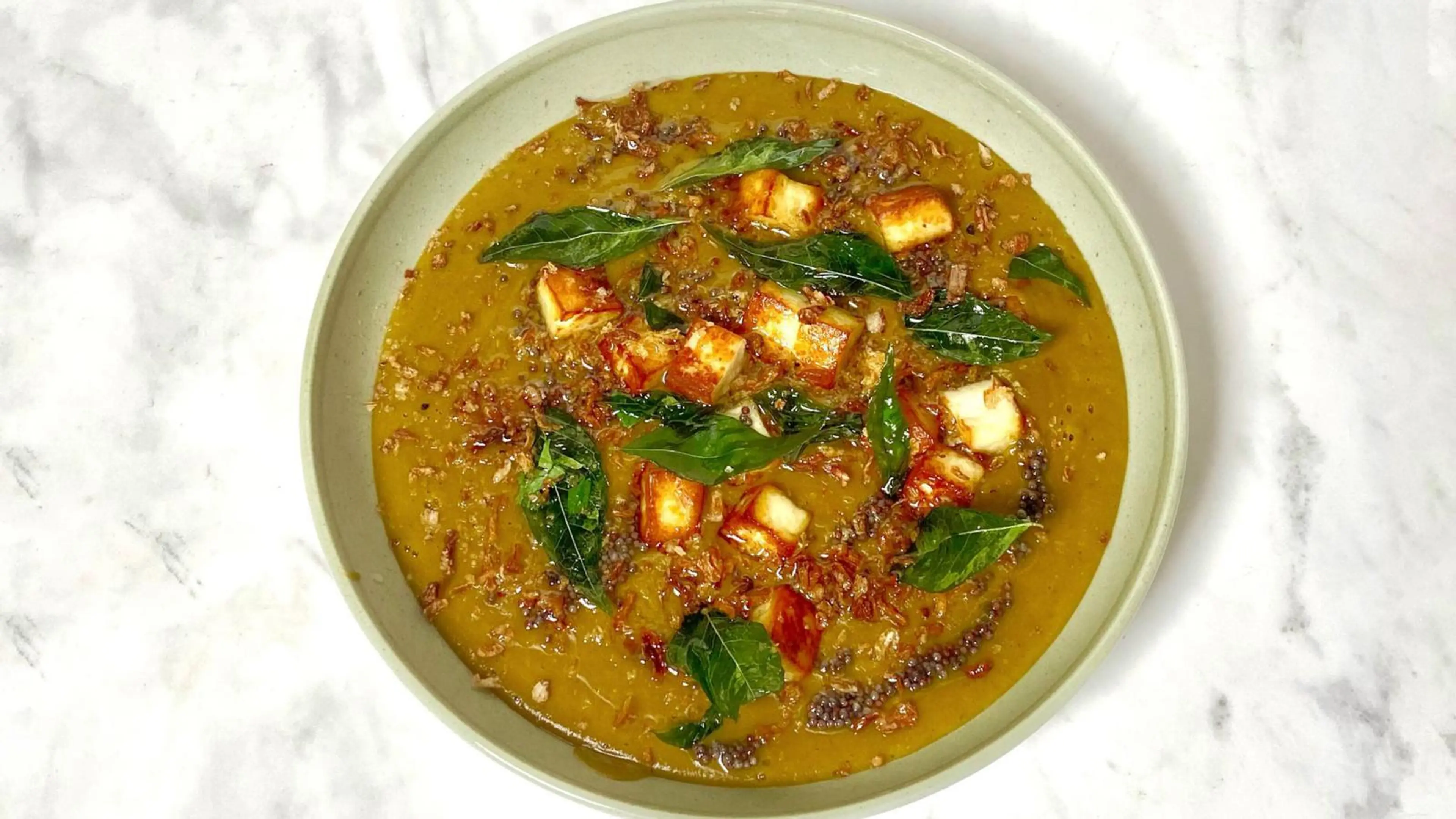 Lentil and onion soup with crispy paneer tarka
