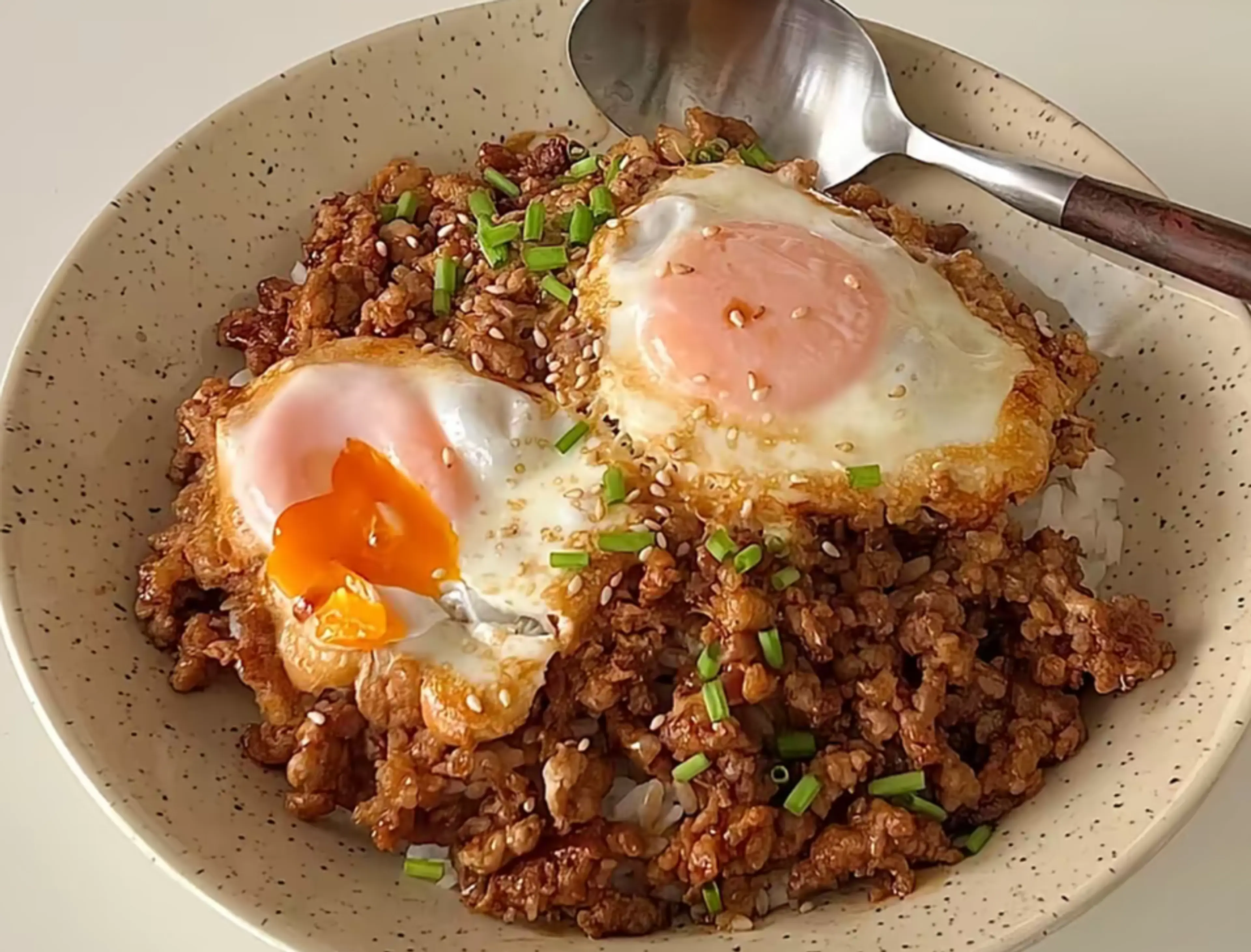 Pork mince with poached egg rice bowl