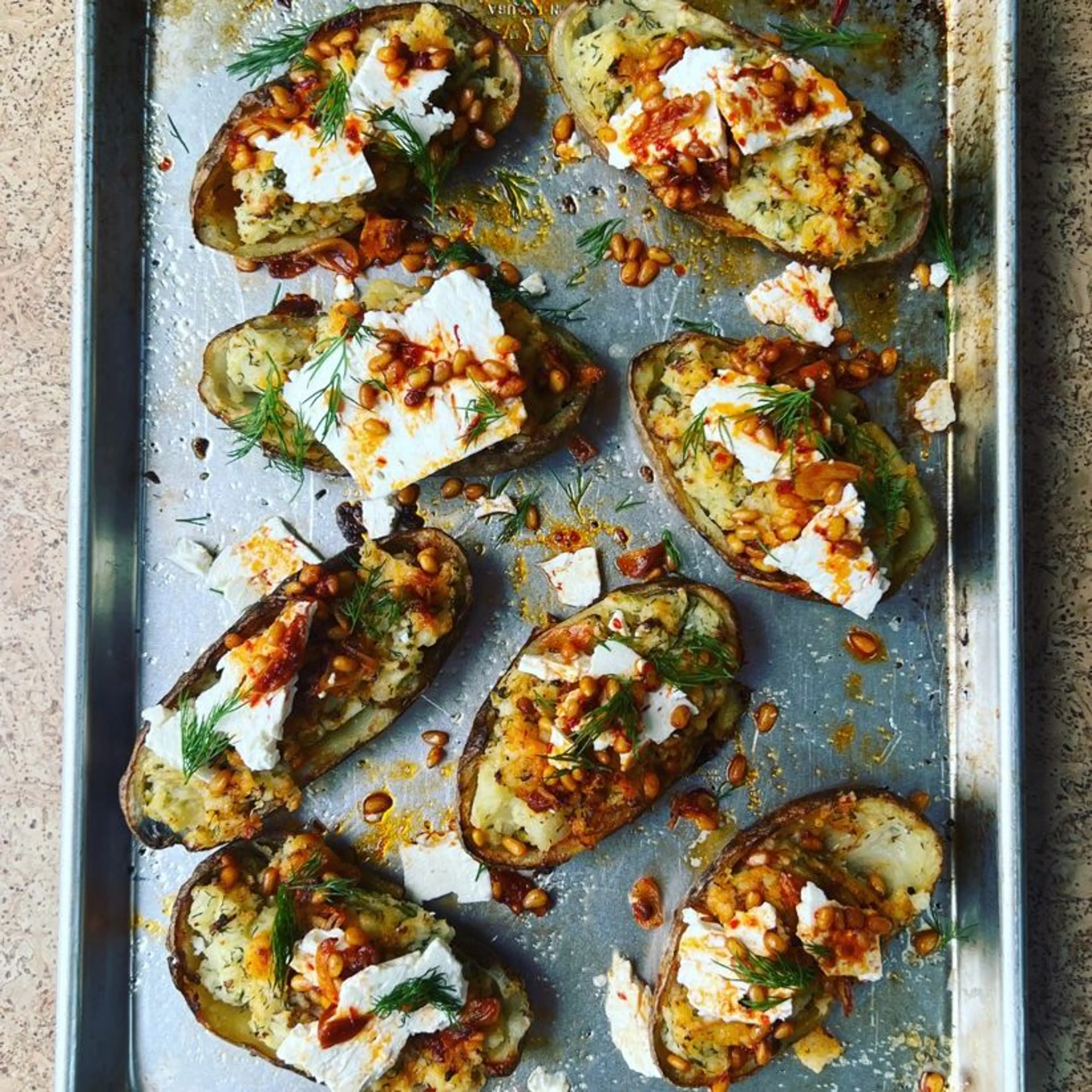 Thrice Baked Potatoes with Sizzled Pine Nuts & Harissa