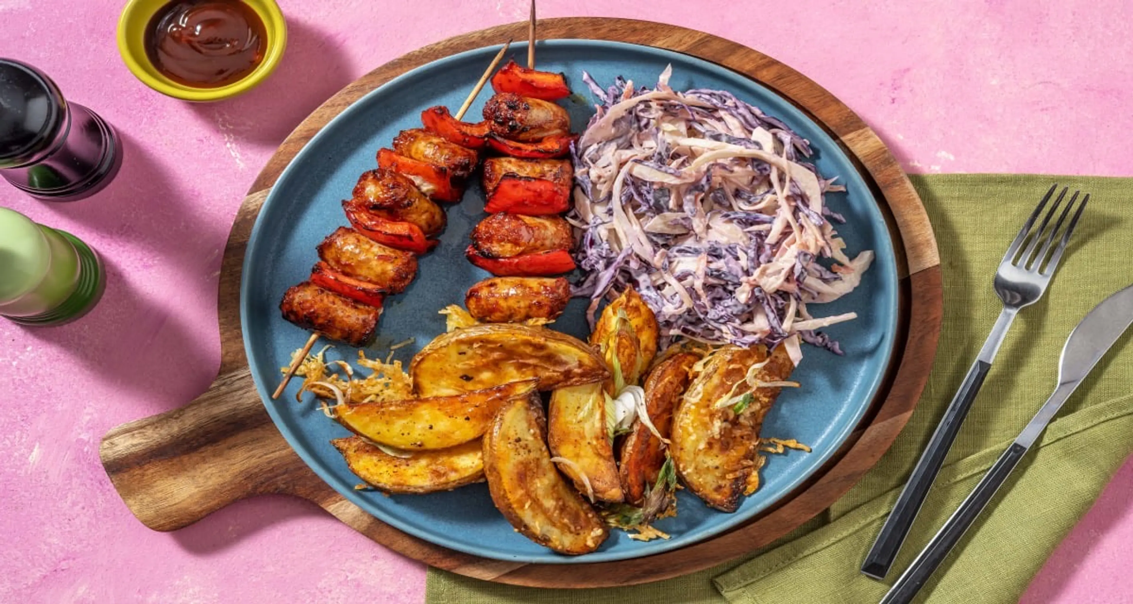 Smoky BBQ Sausage Skewers With Roasted Garlic Slaw & Cheesy