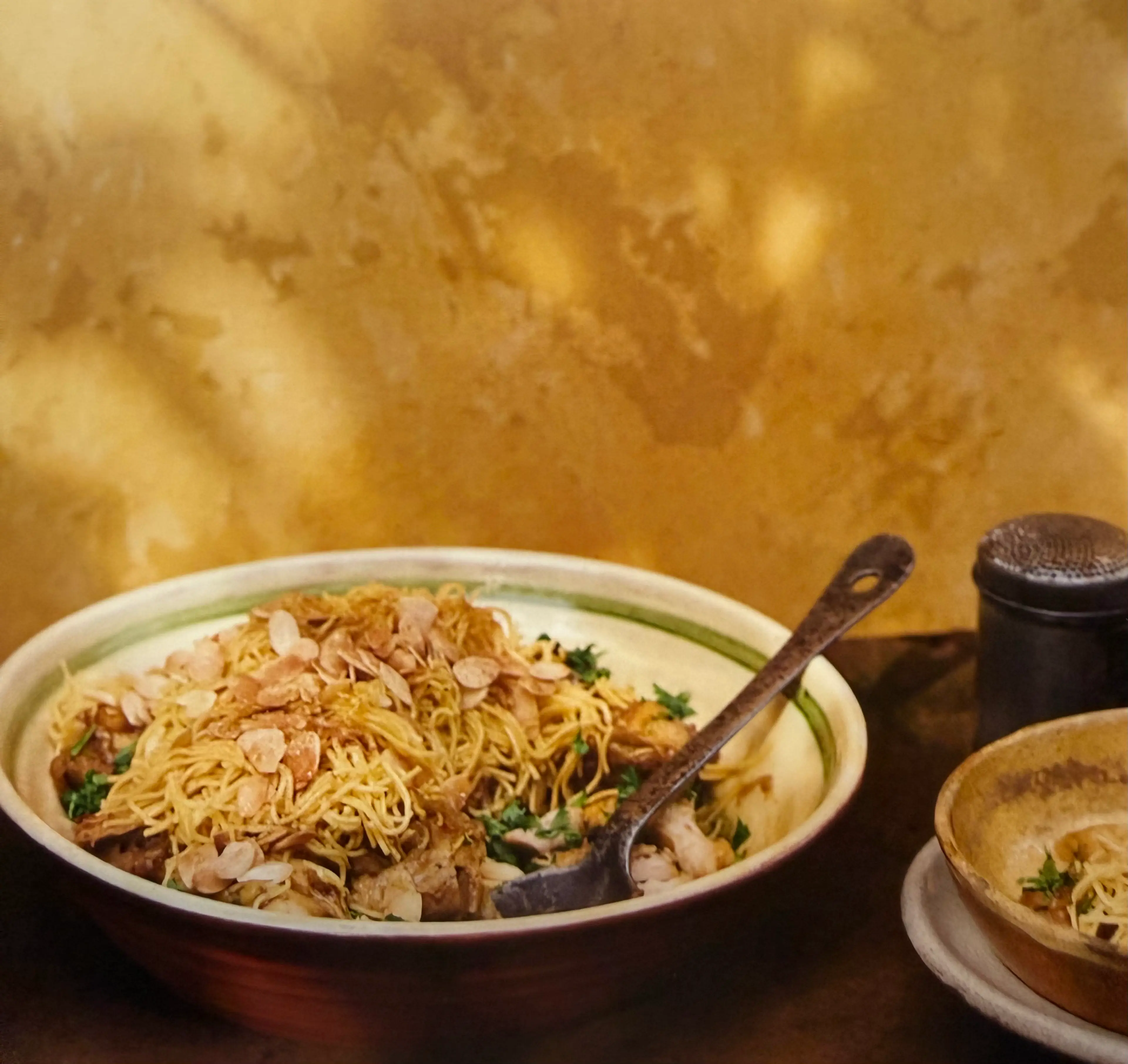 Chicken in a spicy honey sauce buried in vermicelli