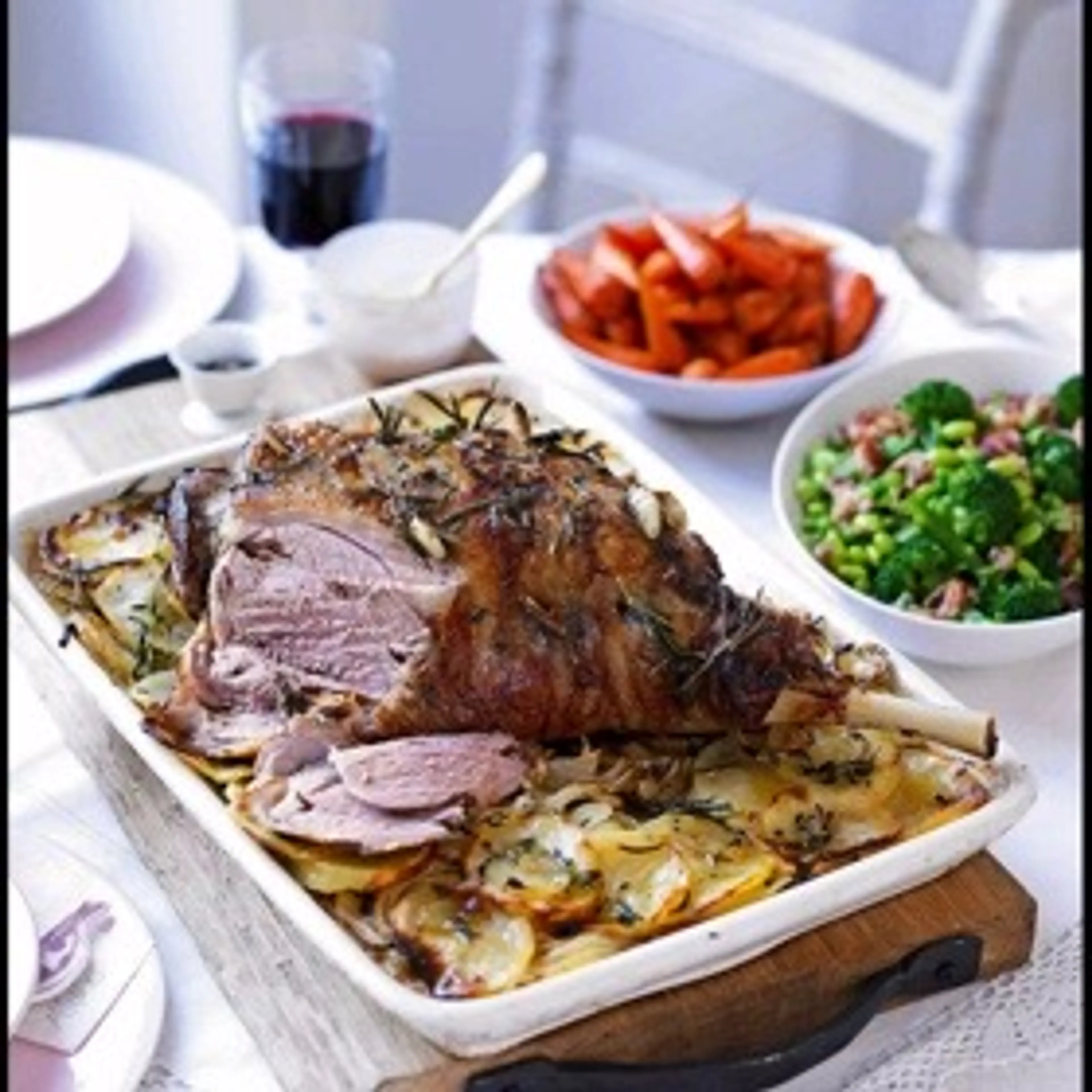 Garlic & herb roast lamb on boulangöre potatoes