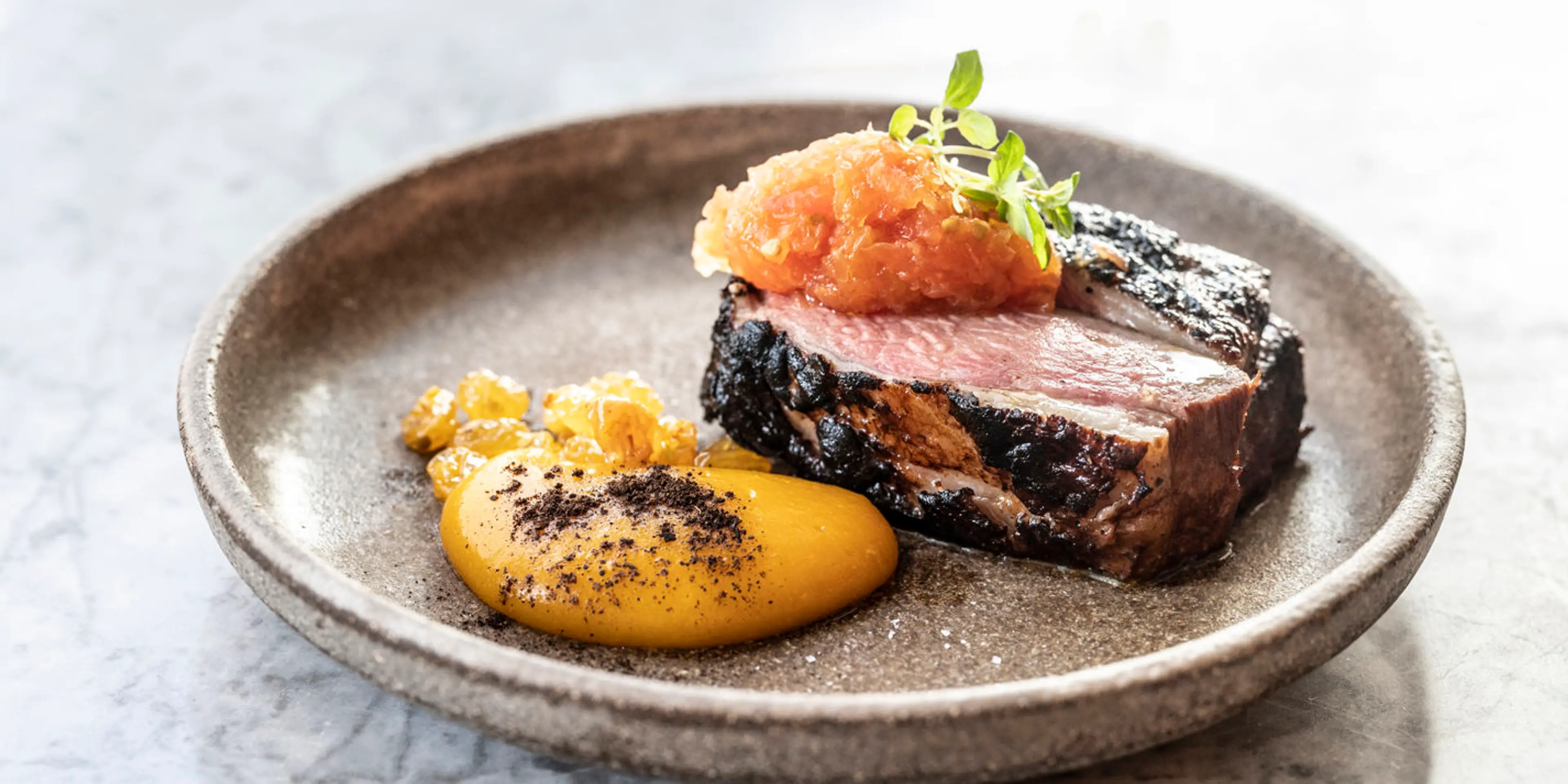 Mazandarani lamb with apricot purée and saffron tomato salsa