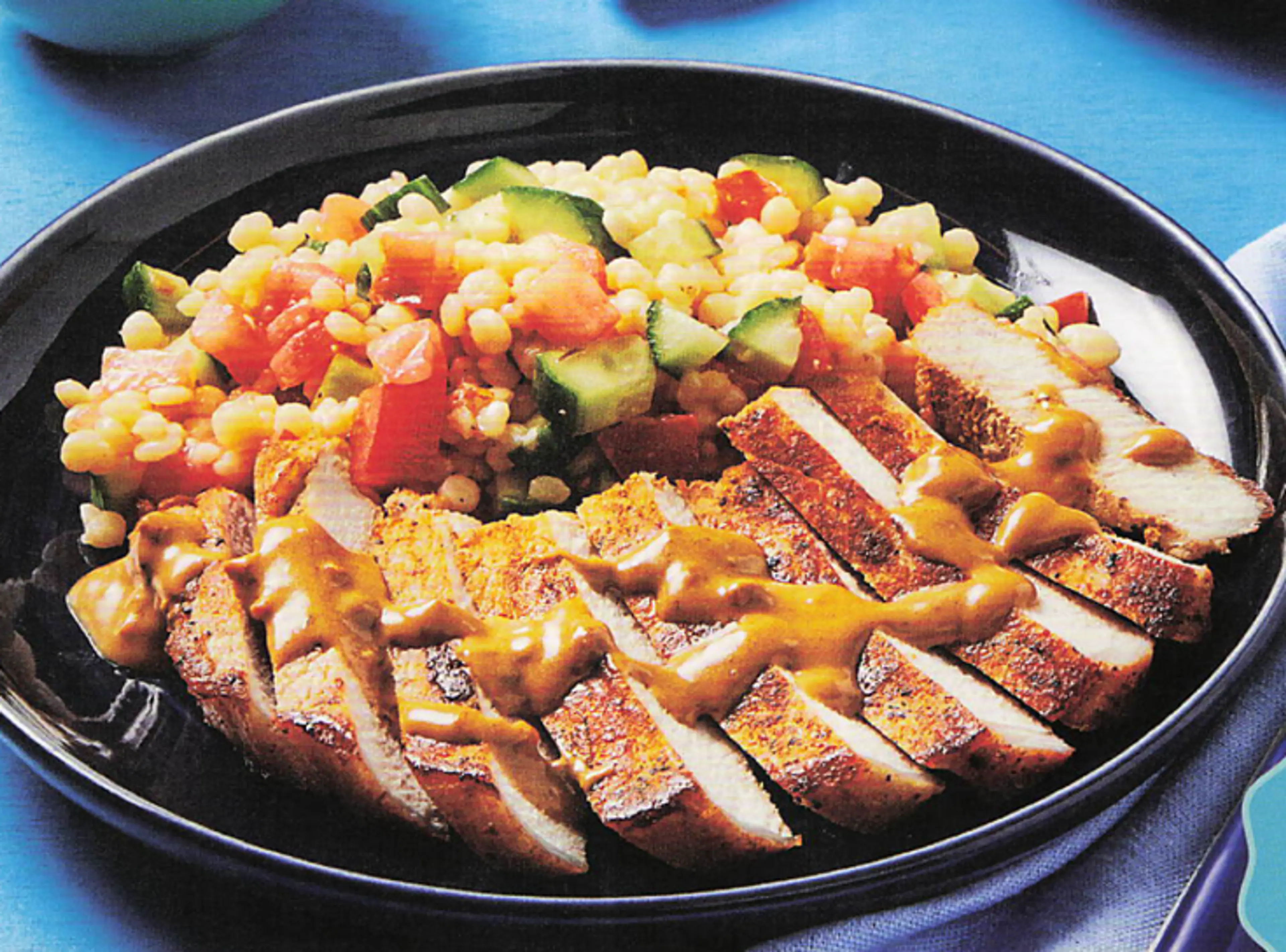 GREEK TAVERNA PORK CHOPS with Cucumber-Tomato Couscous Salad
