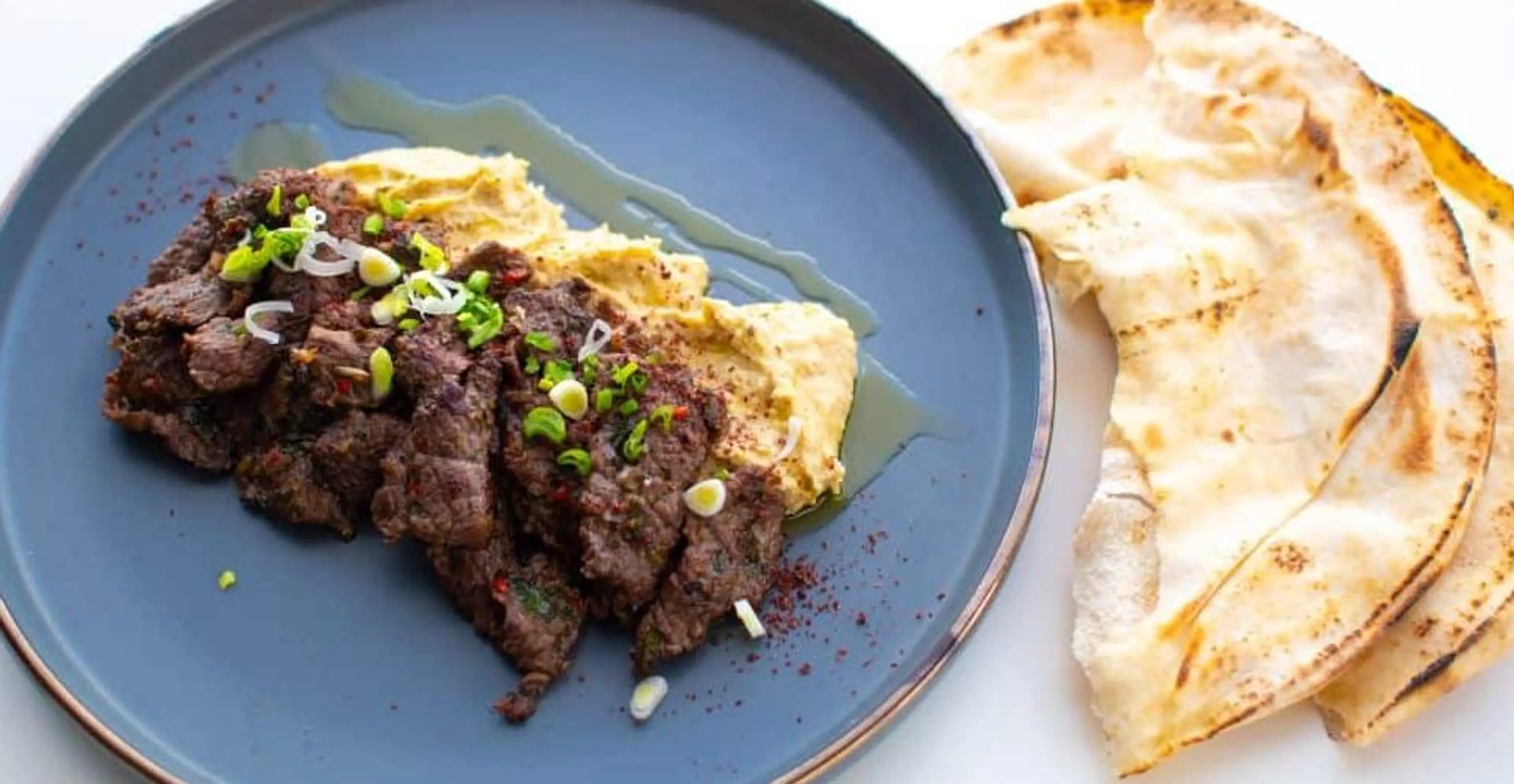 Thinly Sliced Ribeye with Hummus and Capers