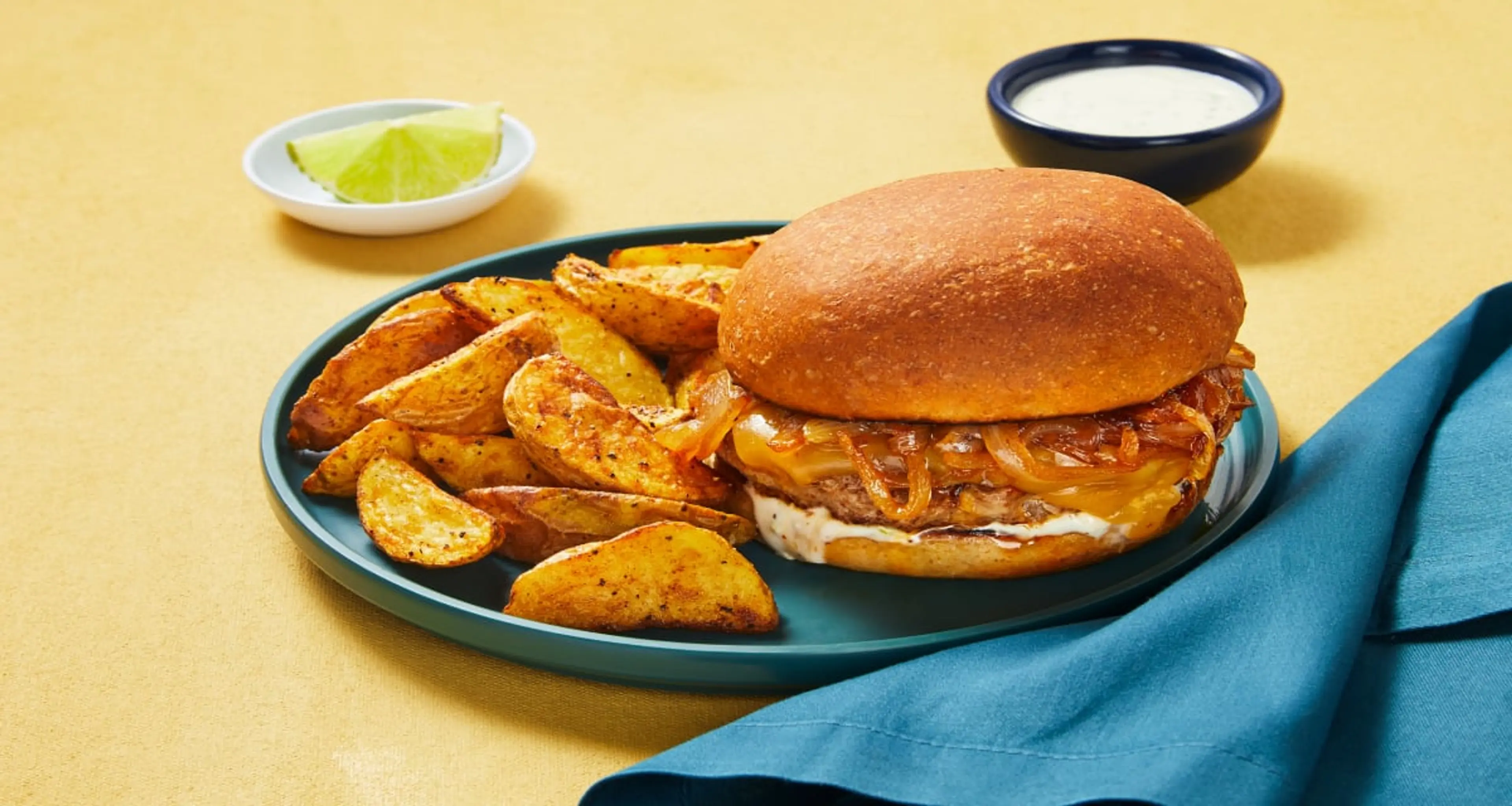 Gouda Beef Burgers with Potato Wedges & Caramelized Sriracha