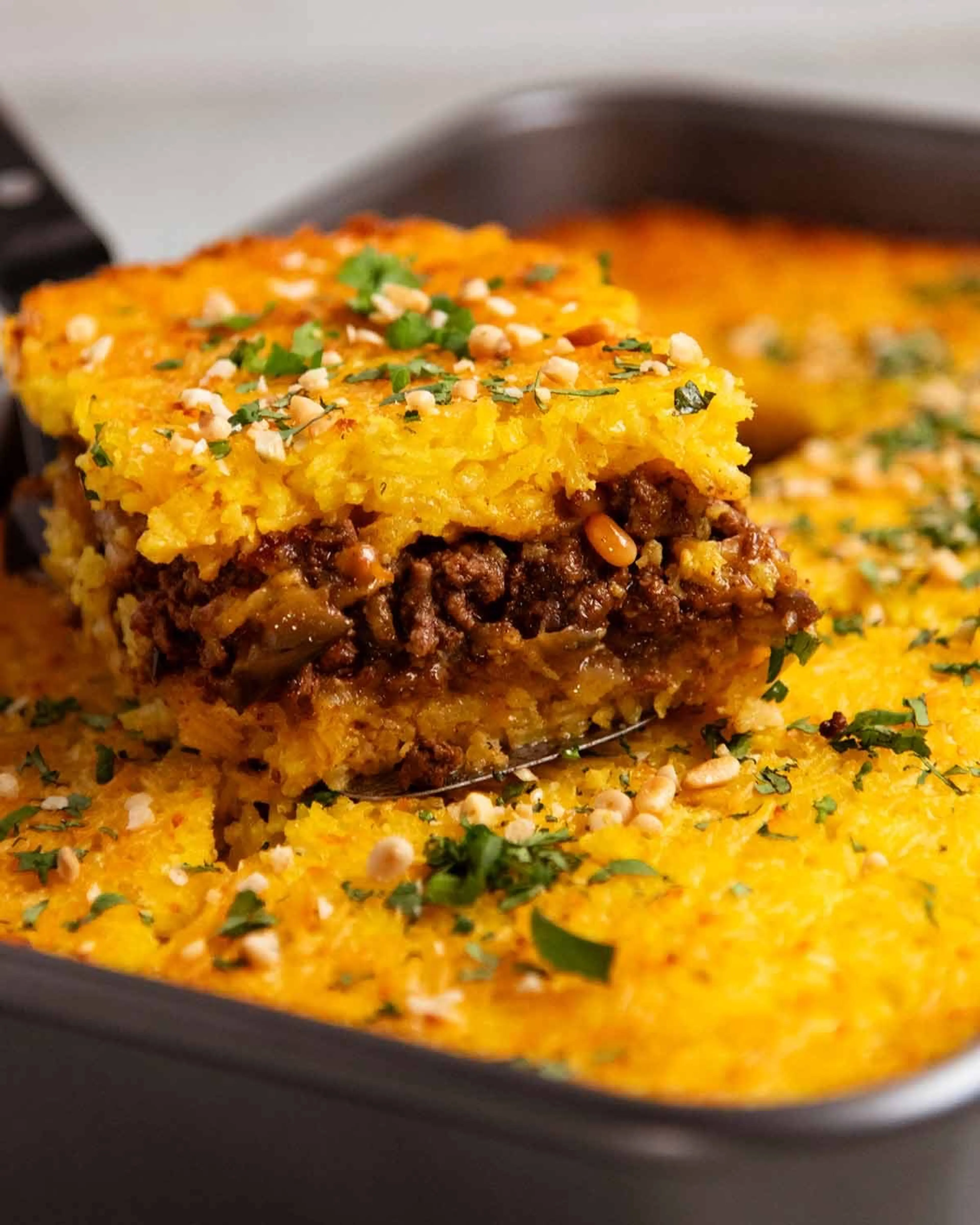 Layered Golden Rice Bake with Spiced Meat