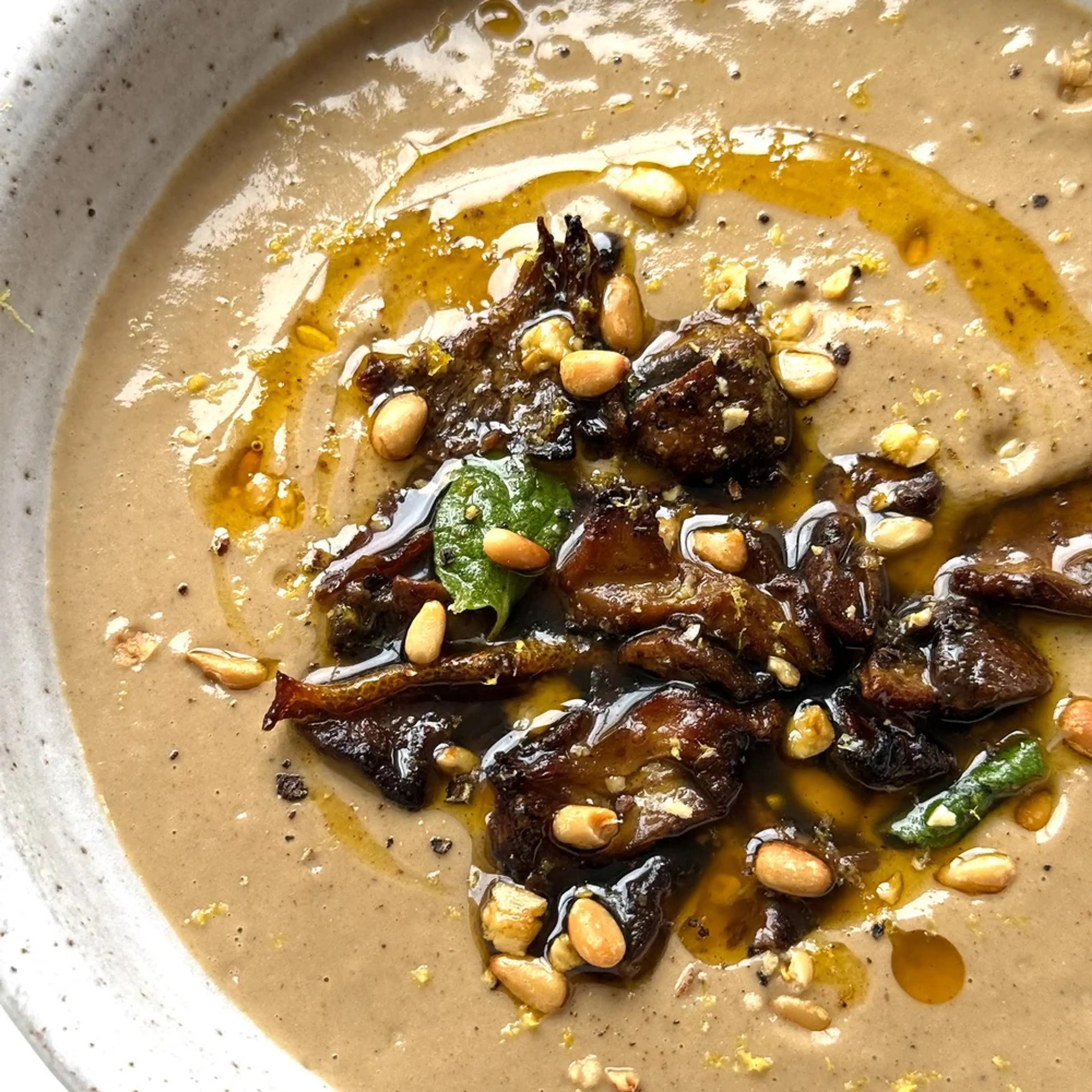Creamy mushroom soup with sticky ras el hanout mushrooms