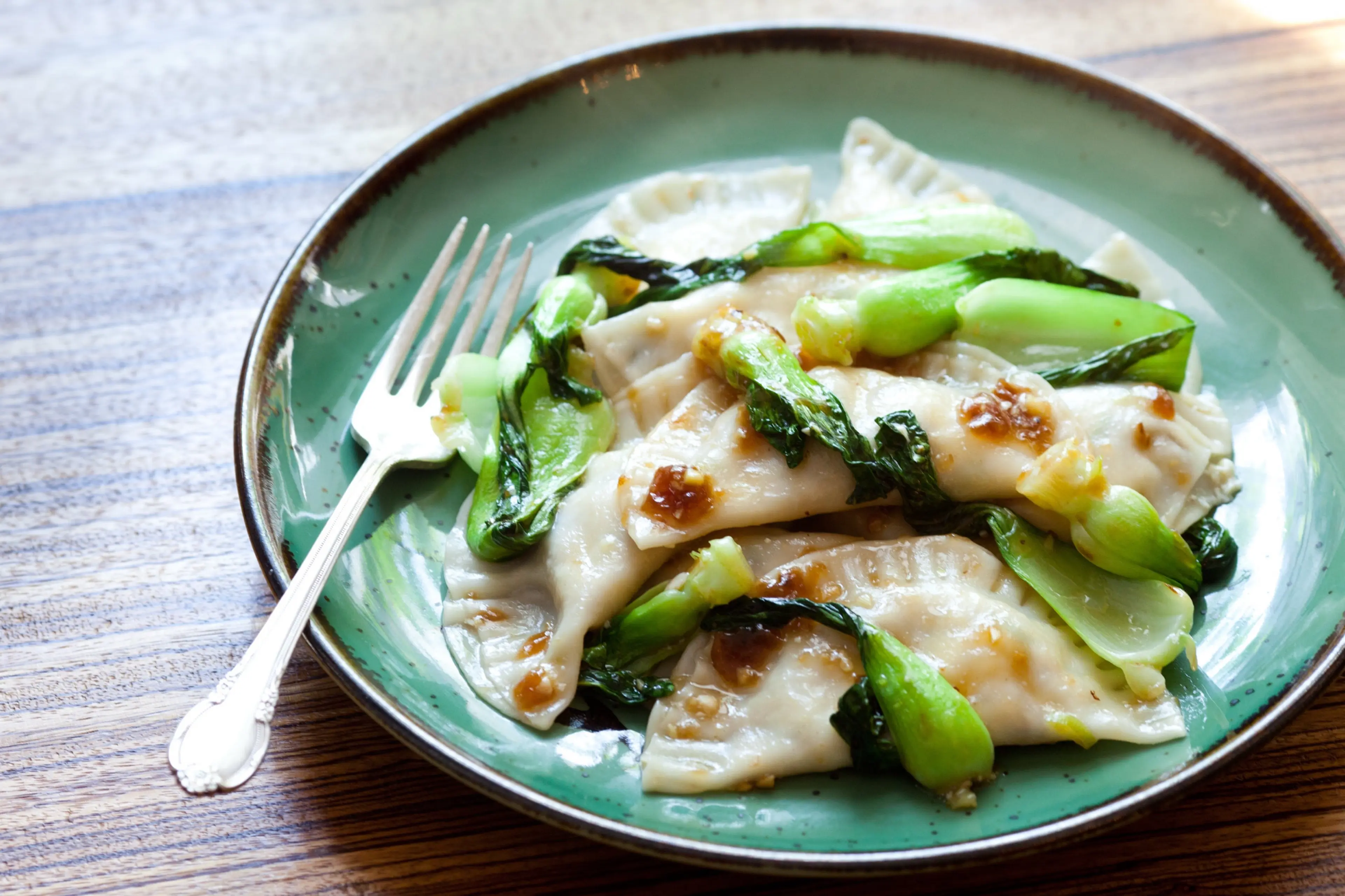 Tofu Ravioli with Glazed Baby Bok Choy Leaves