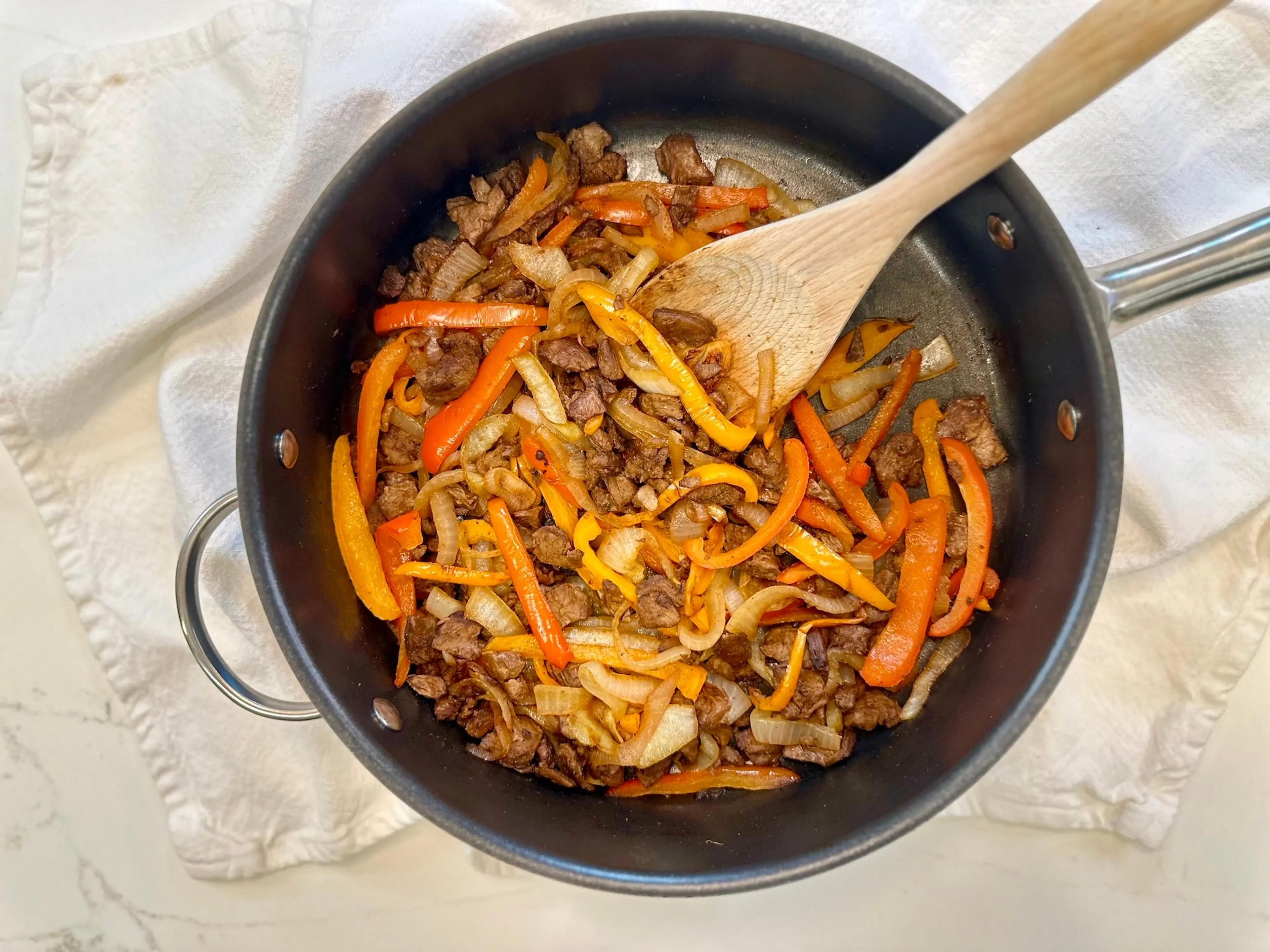 Plant-based Steak, Peppers, and Onions