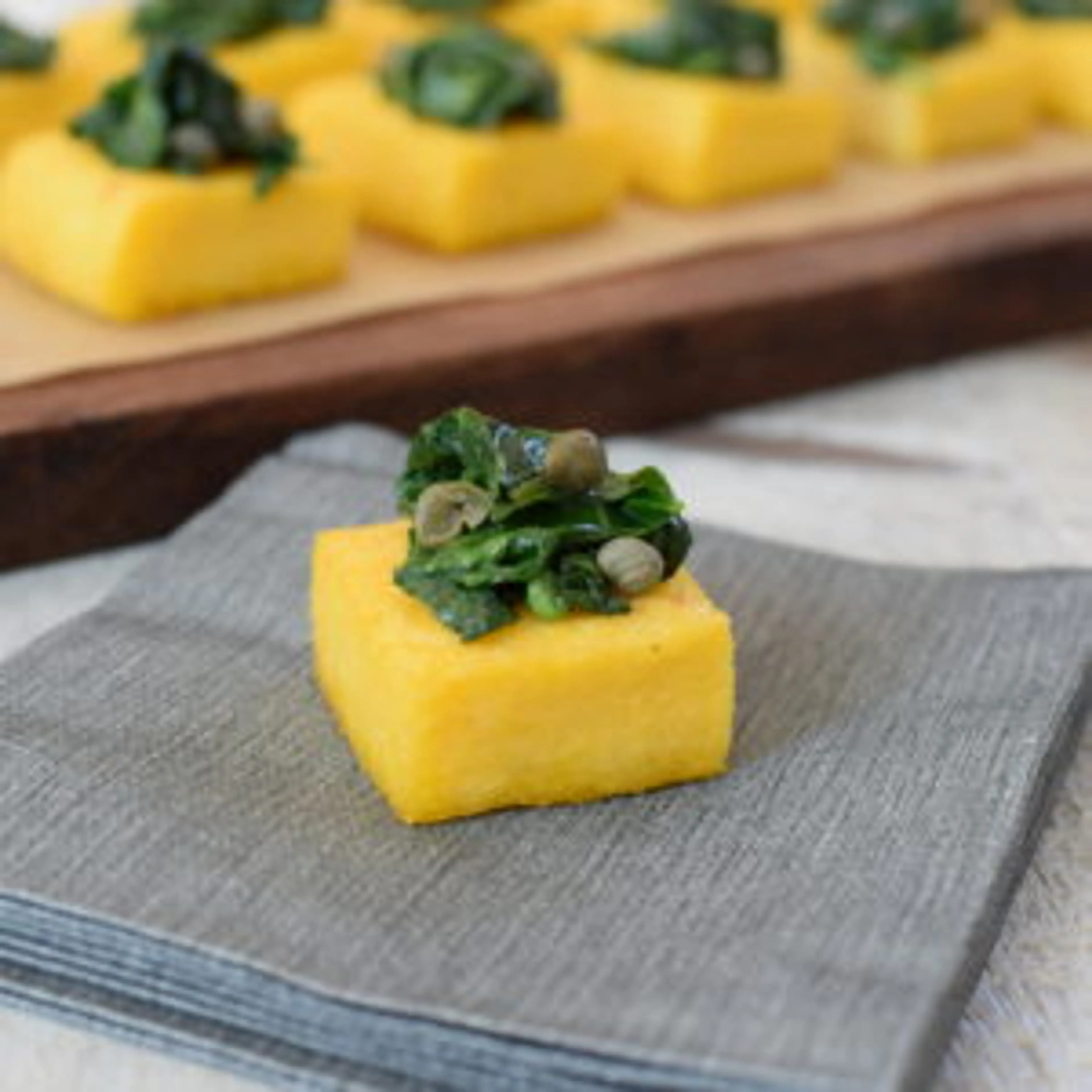 Polenta Crostini with Sautéed Spinach Recipe