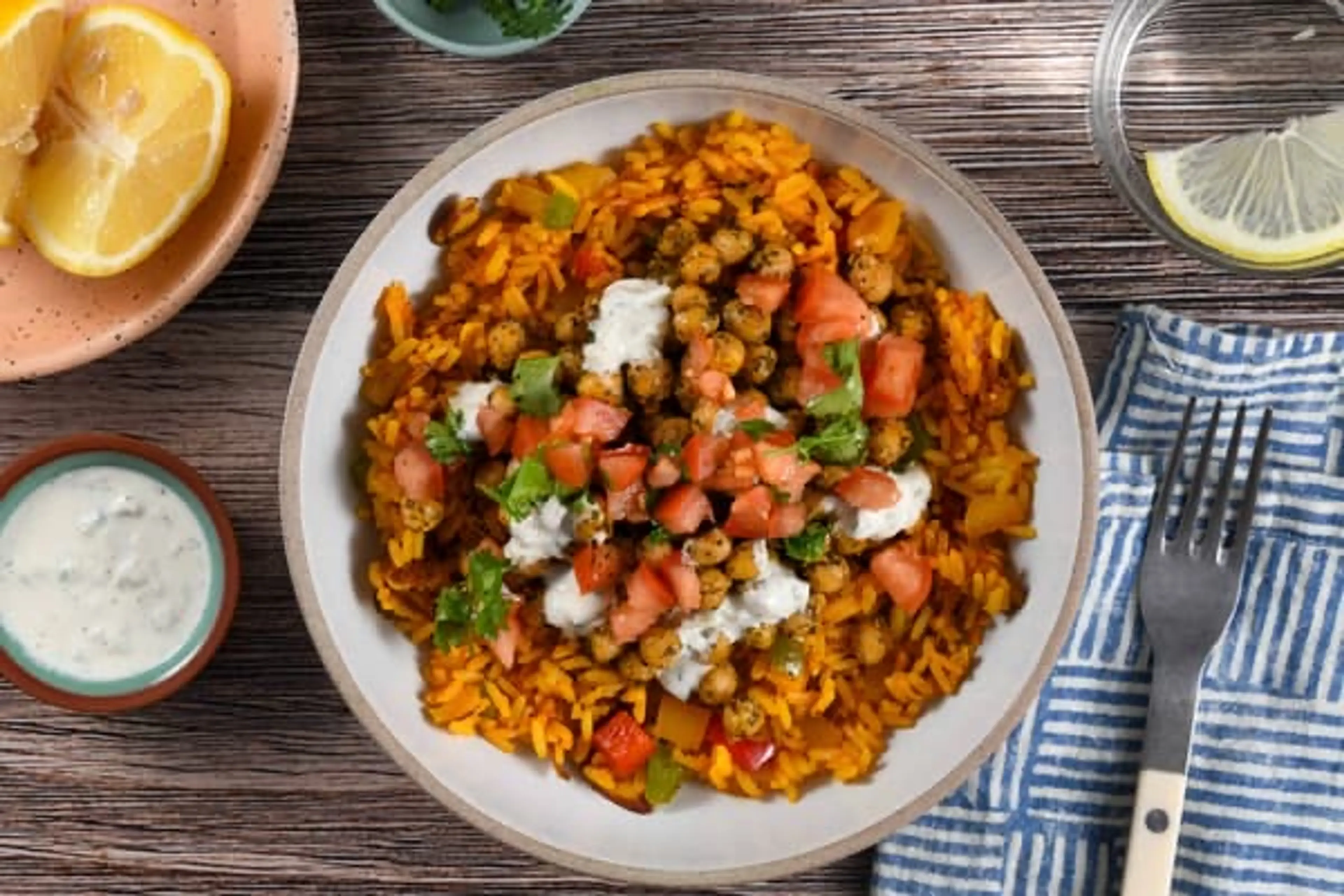 Chimichurri Chickpea Rice Pilaf Bowl with tzatziki and almon