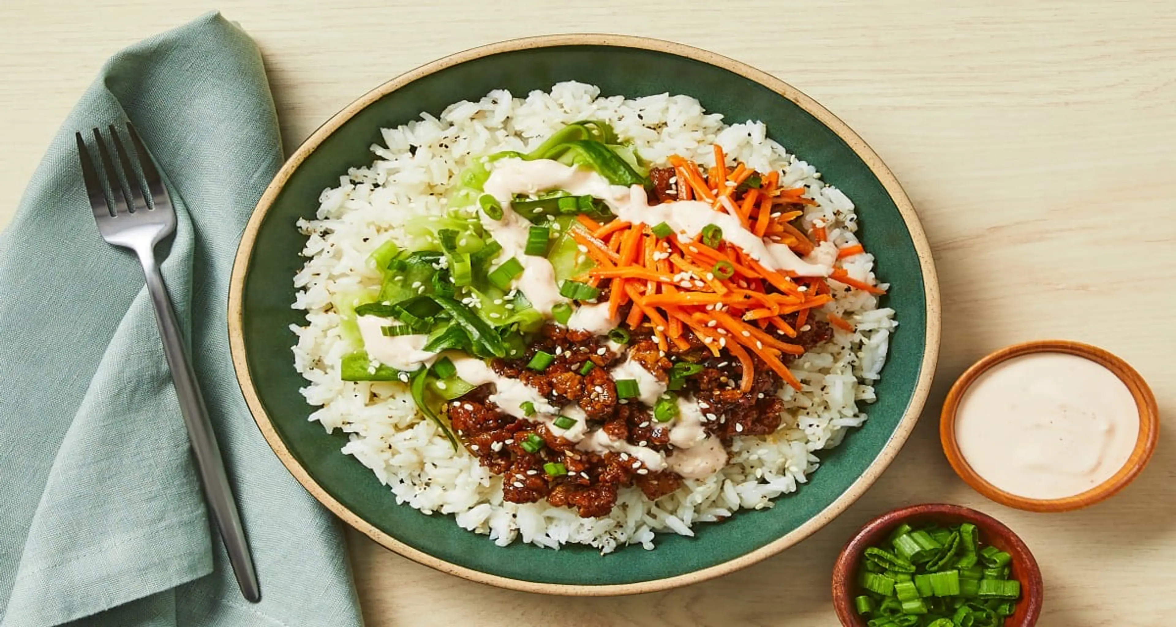 Beef Bulgogi Bowls with Carrots, Pickled Cucumber & Sriracha