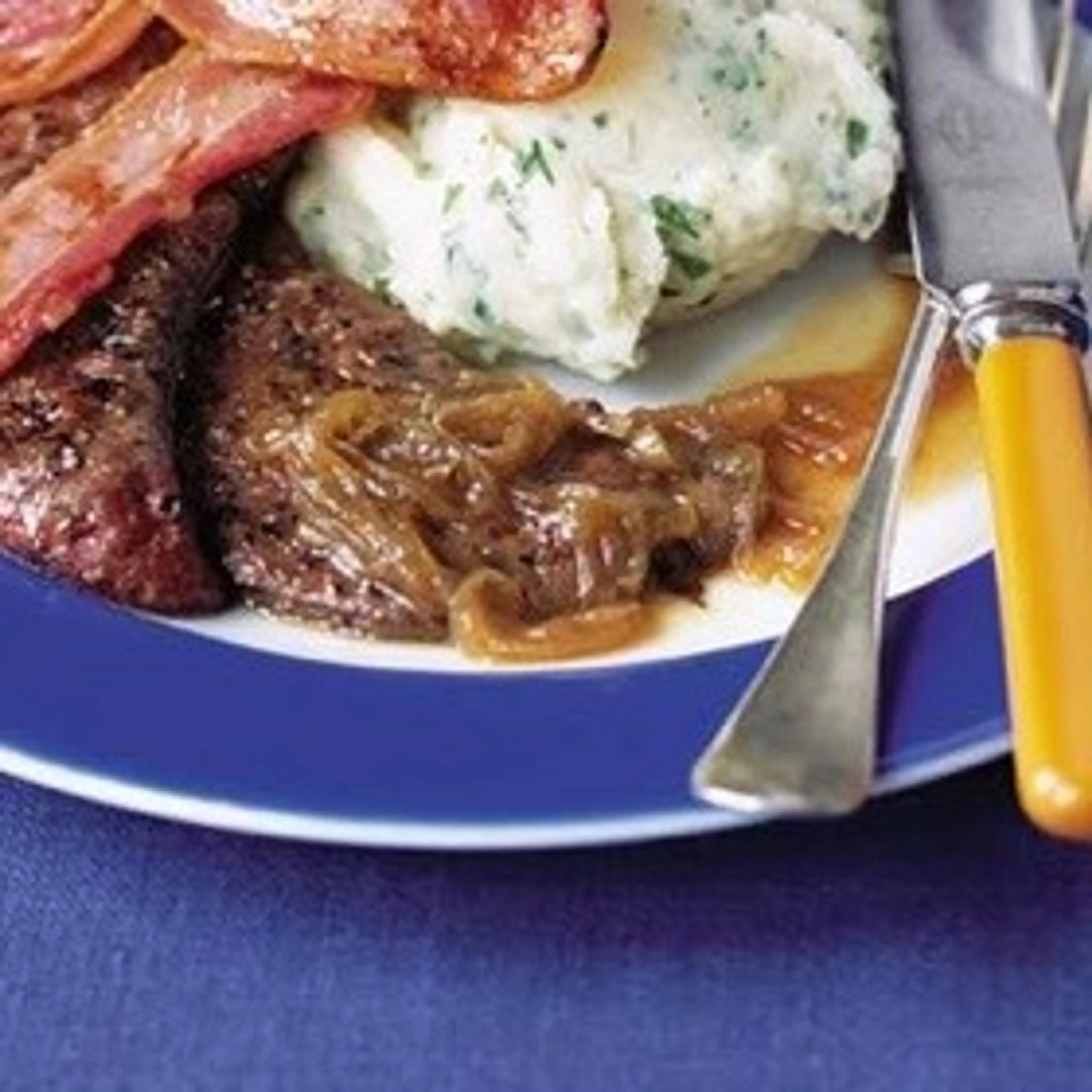 Calves' liver and bacon with onion gravy and parsley mash re