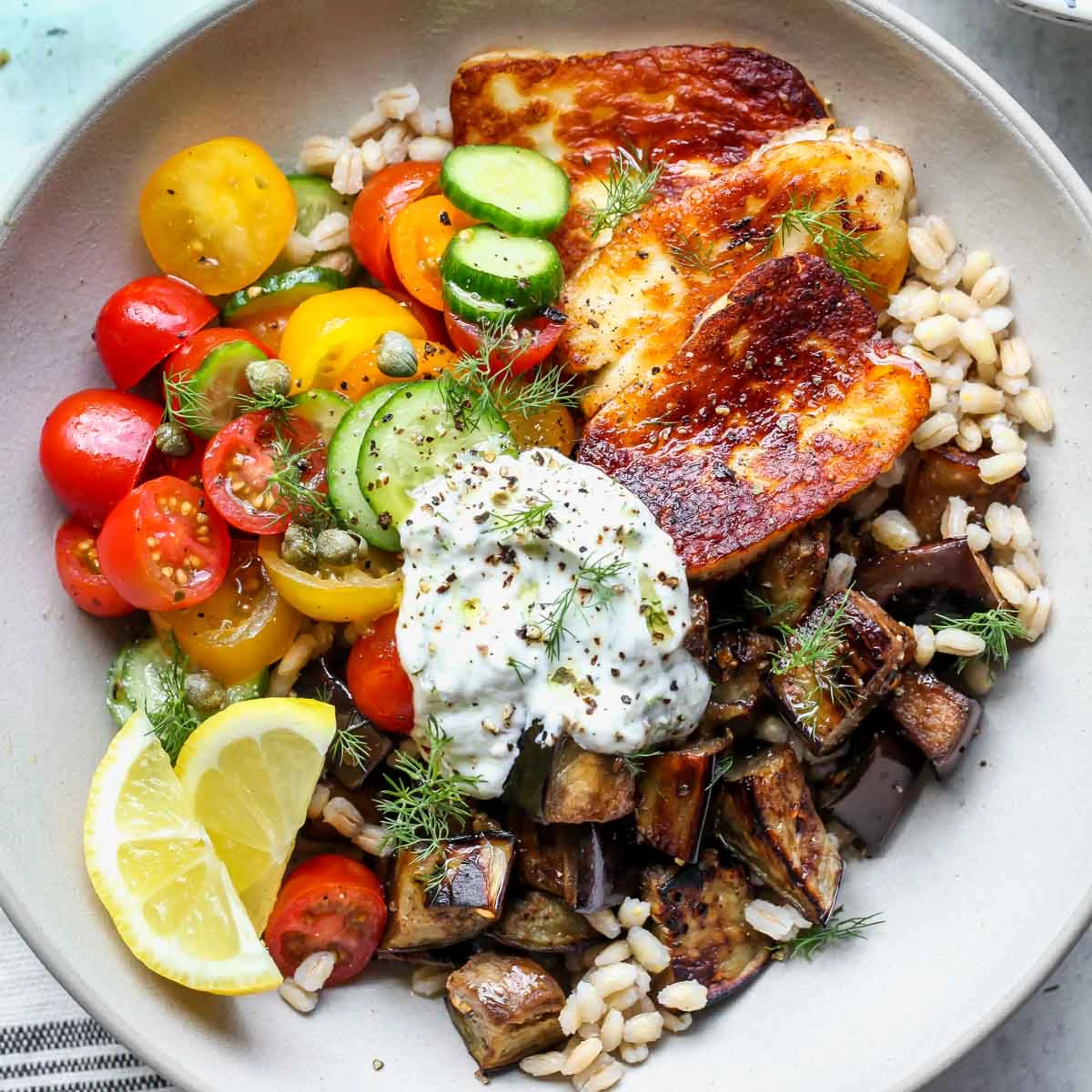 Mediterranean Eggplant and Halloumi Bowls with Lemon-Dill Sa