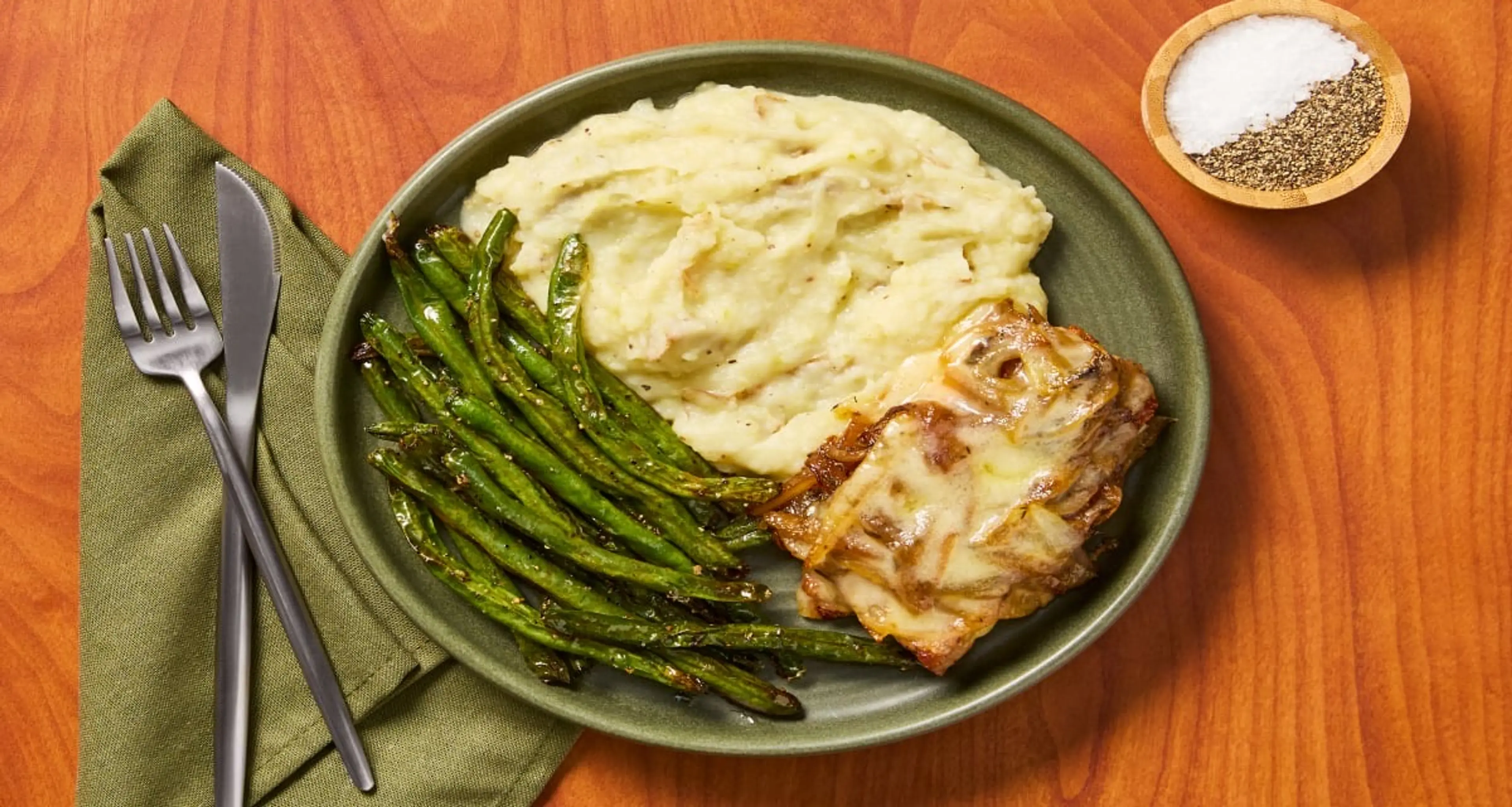 French Onion Smothered Pork Chops with Mashed Potatoes & Gre
