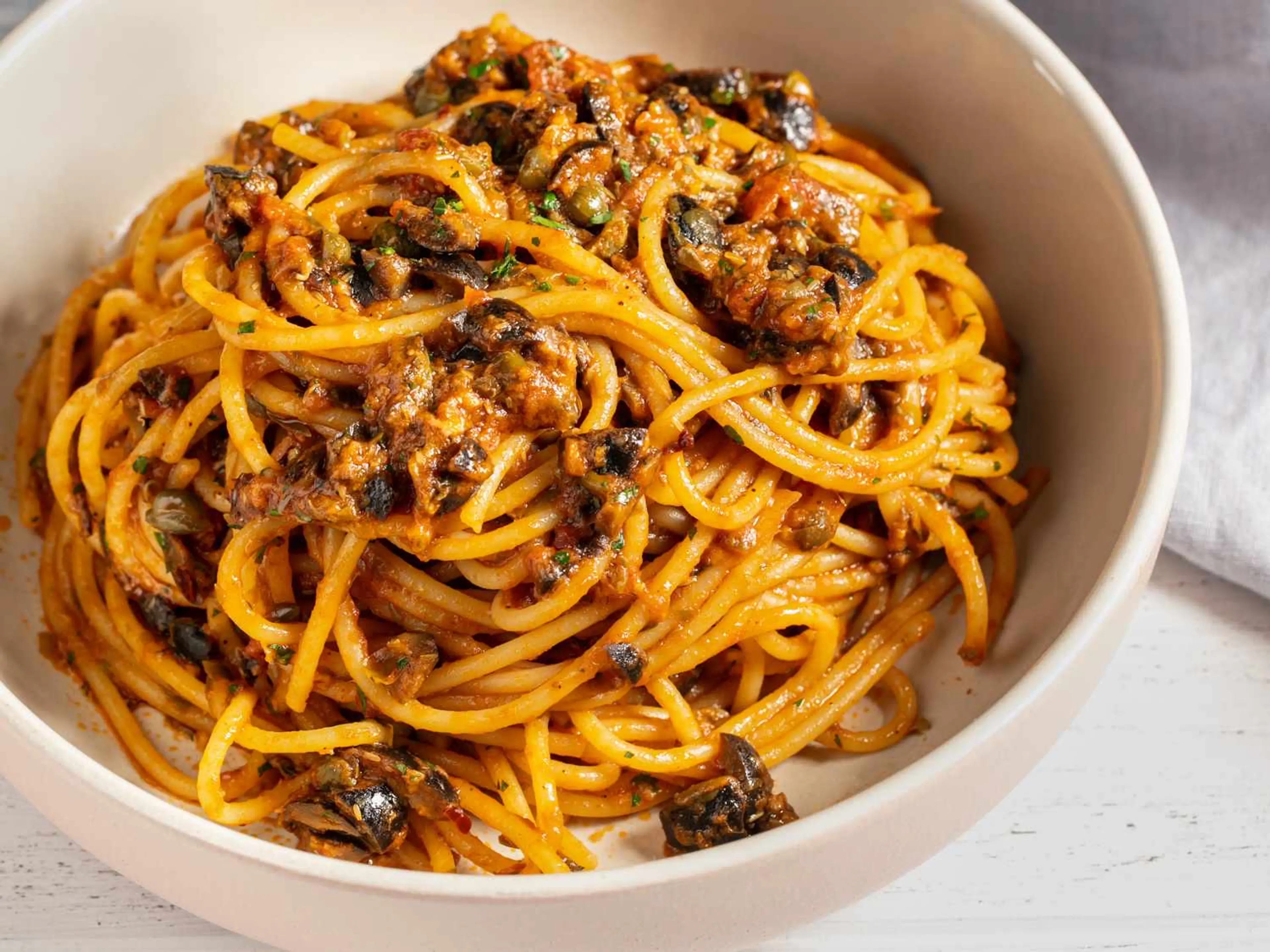 Spaghetti Puttanesca (Spaghetti With Capers, Olives, and Anc