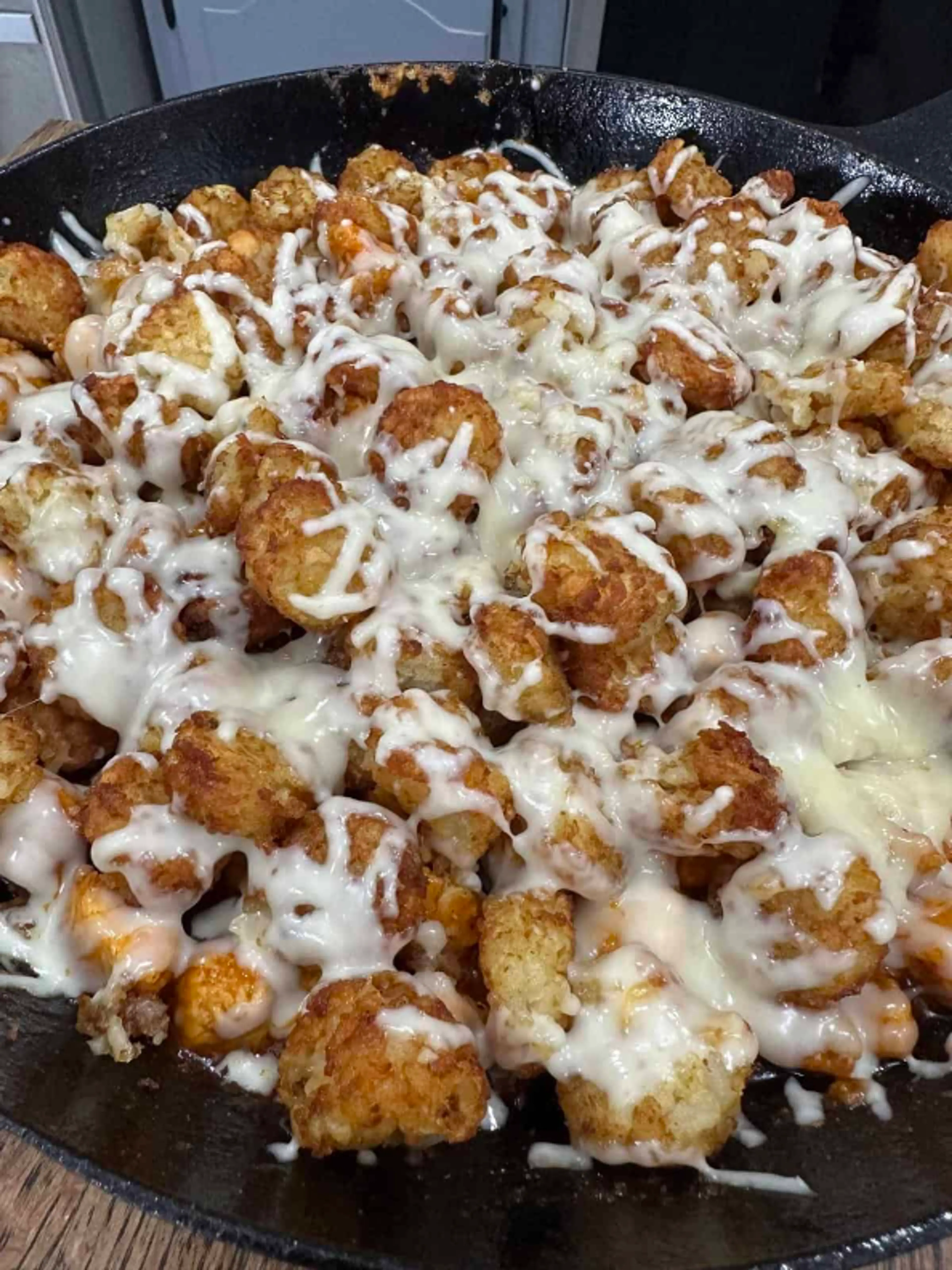 Cheesy BBQ Buffalo Chicken Tater Tot Skillet