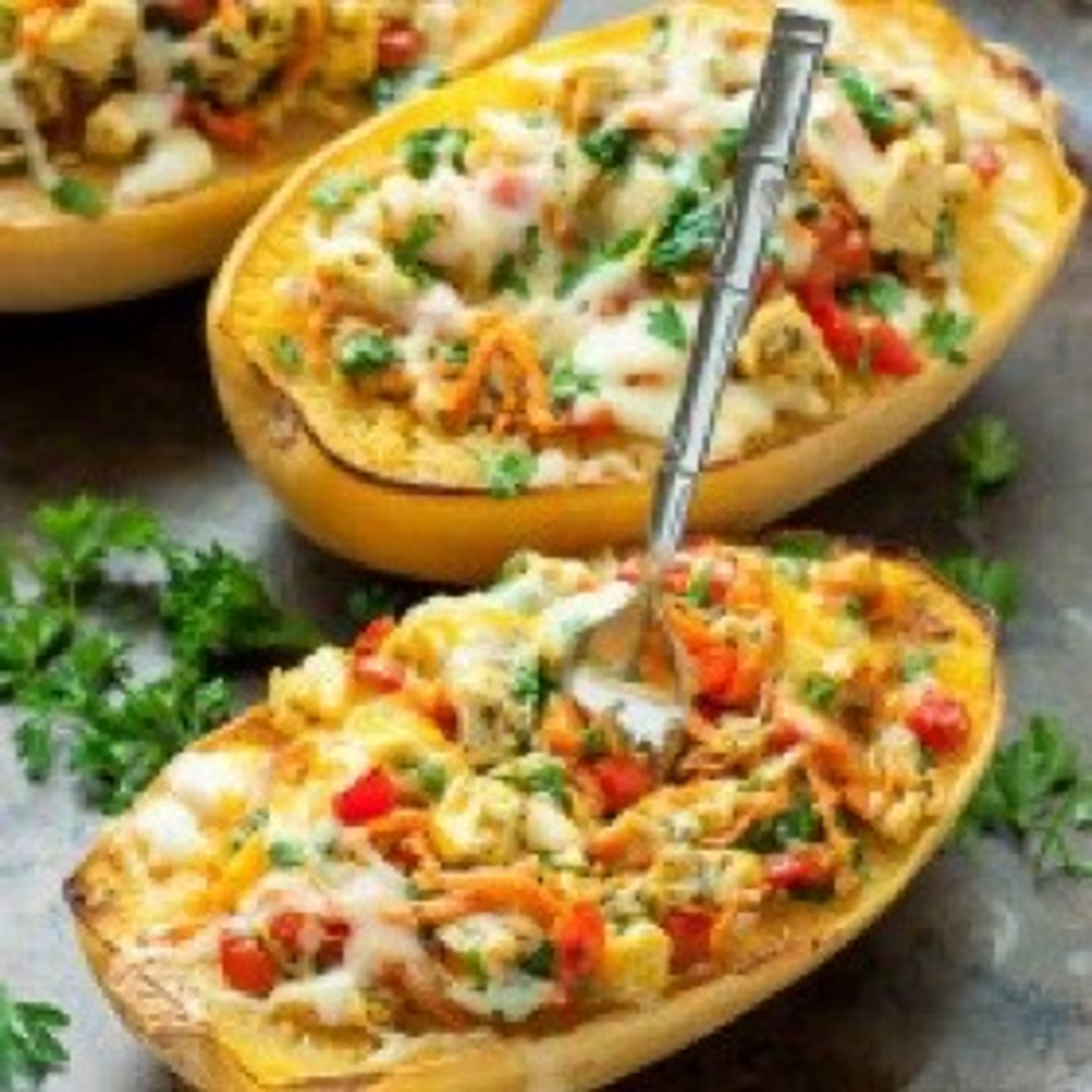 Cheesy Pesto Chicken and Veggie Stuffed Spaghetti Squash