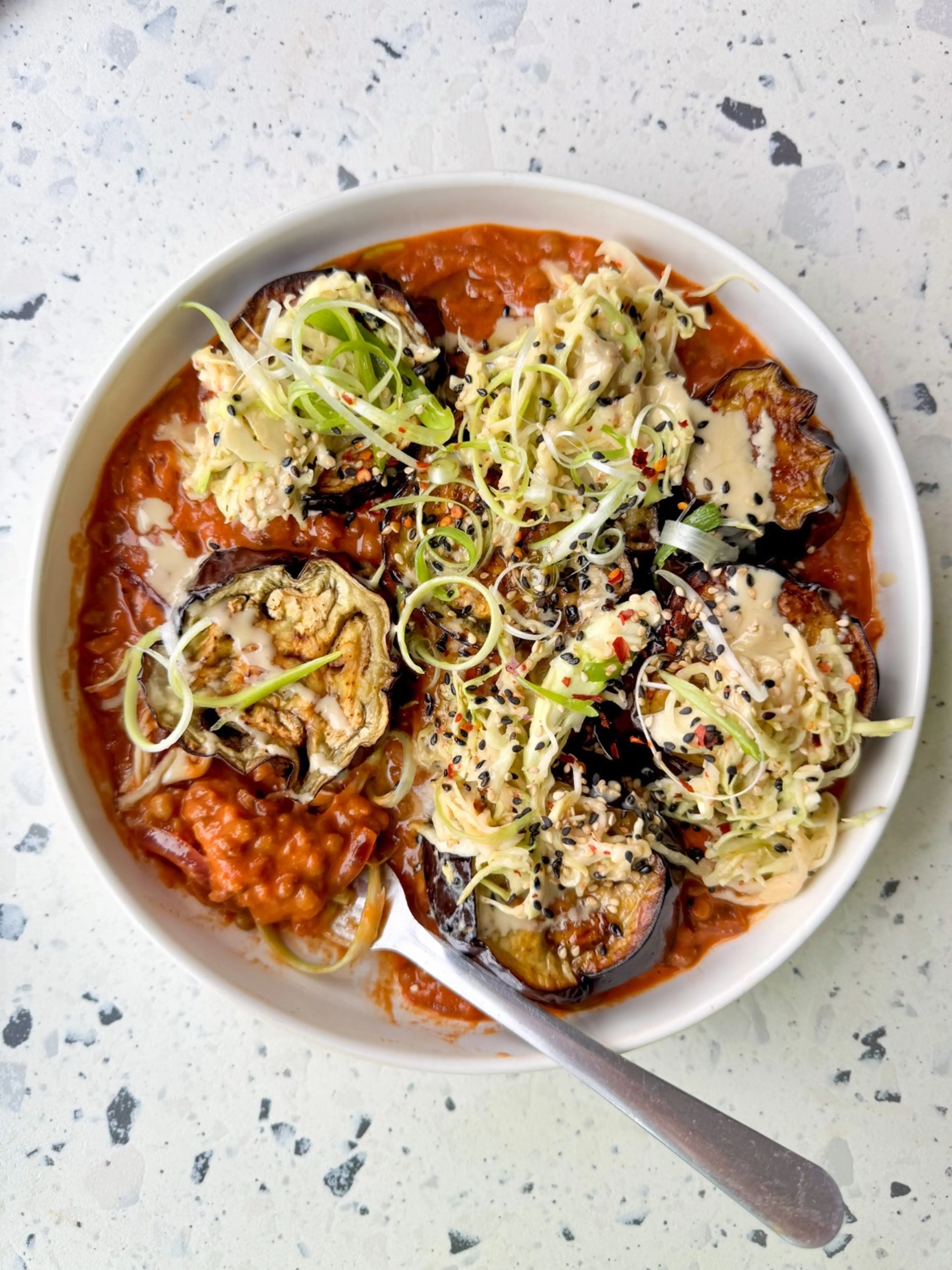 Saucy peanut butter tomatoey lentil curry with aubergine and