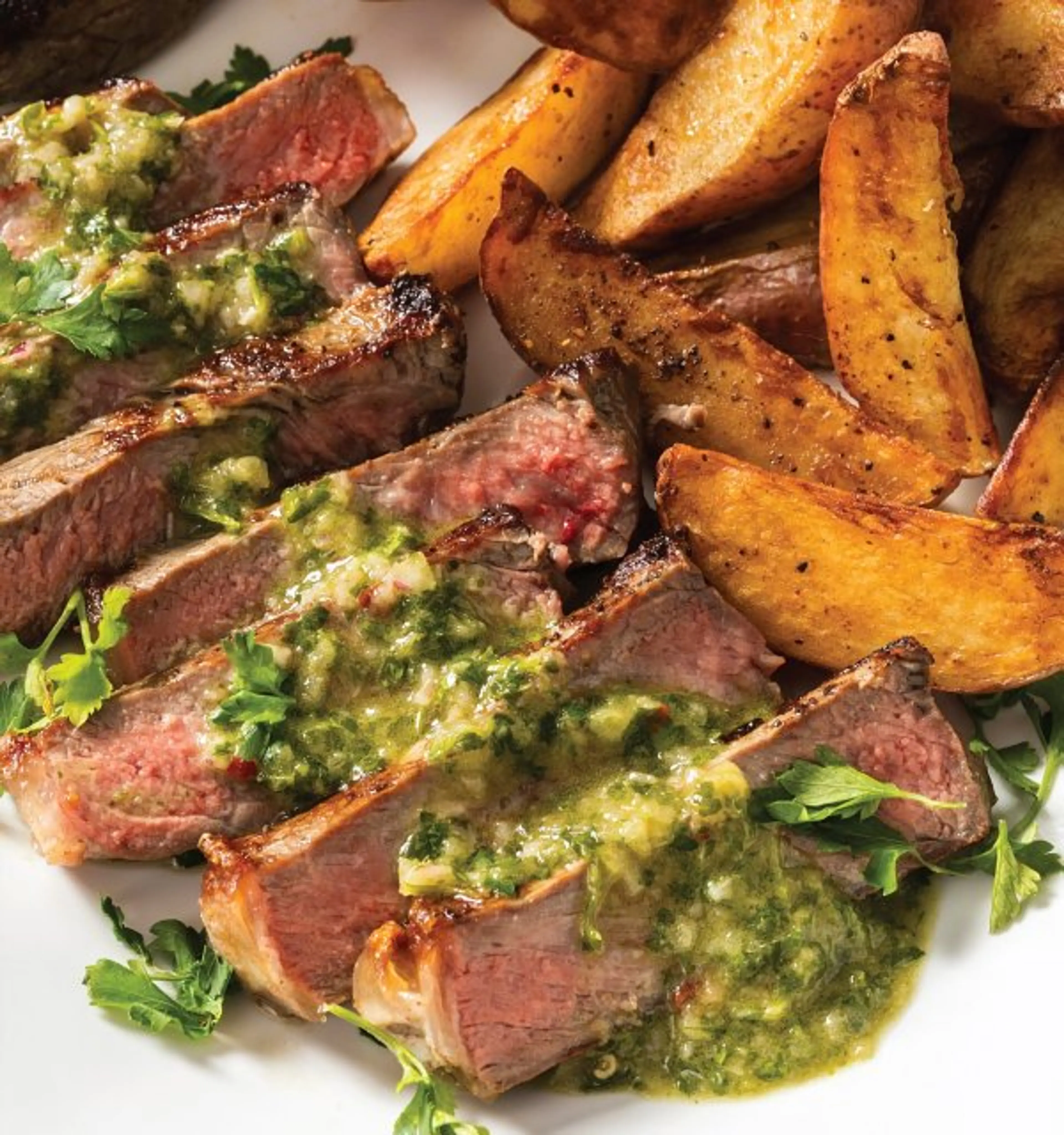 New York Strip Steaks with Crispy Potatoes and Parsley Sauce