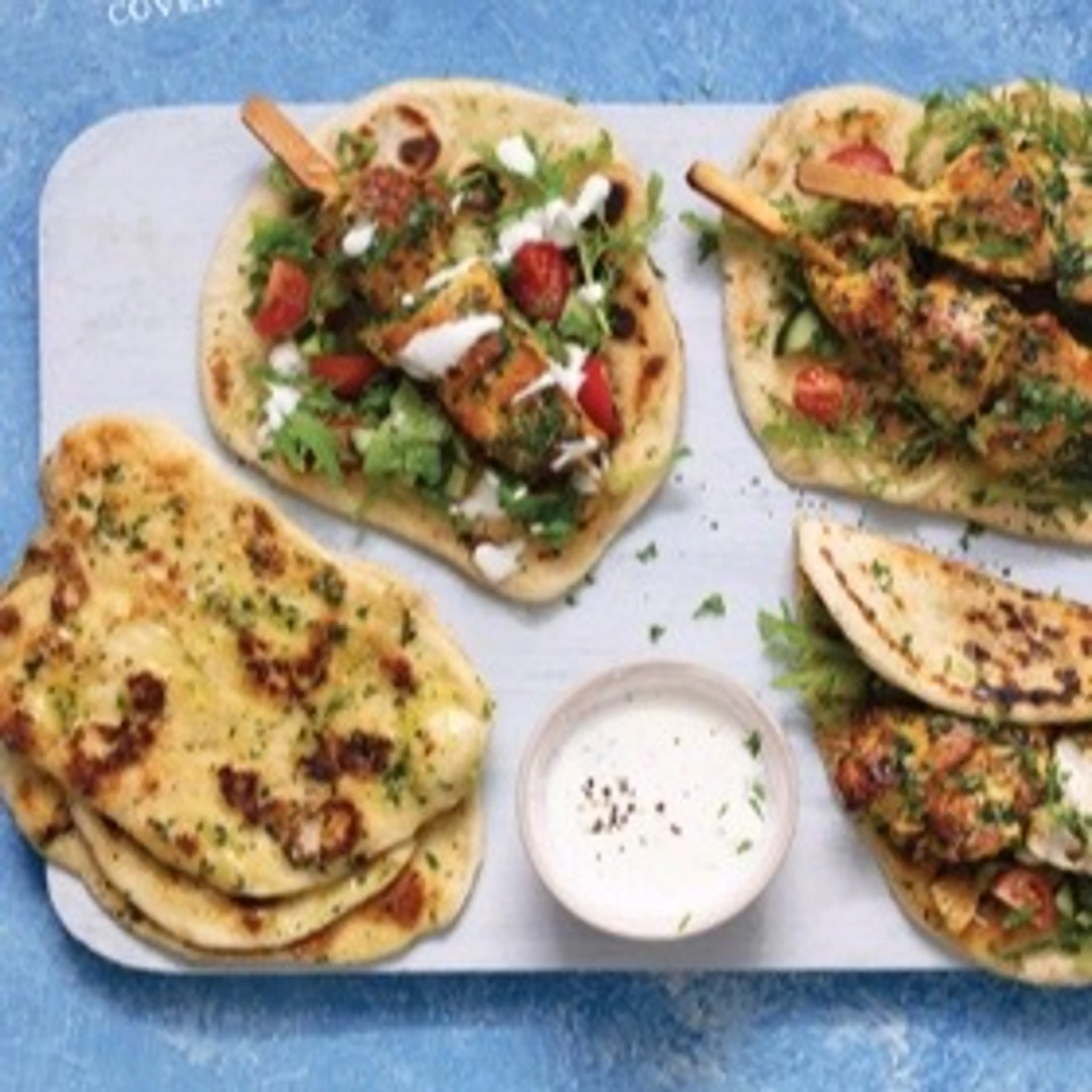 Spiced chicken skewers with garlic herb flatbreads