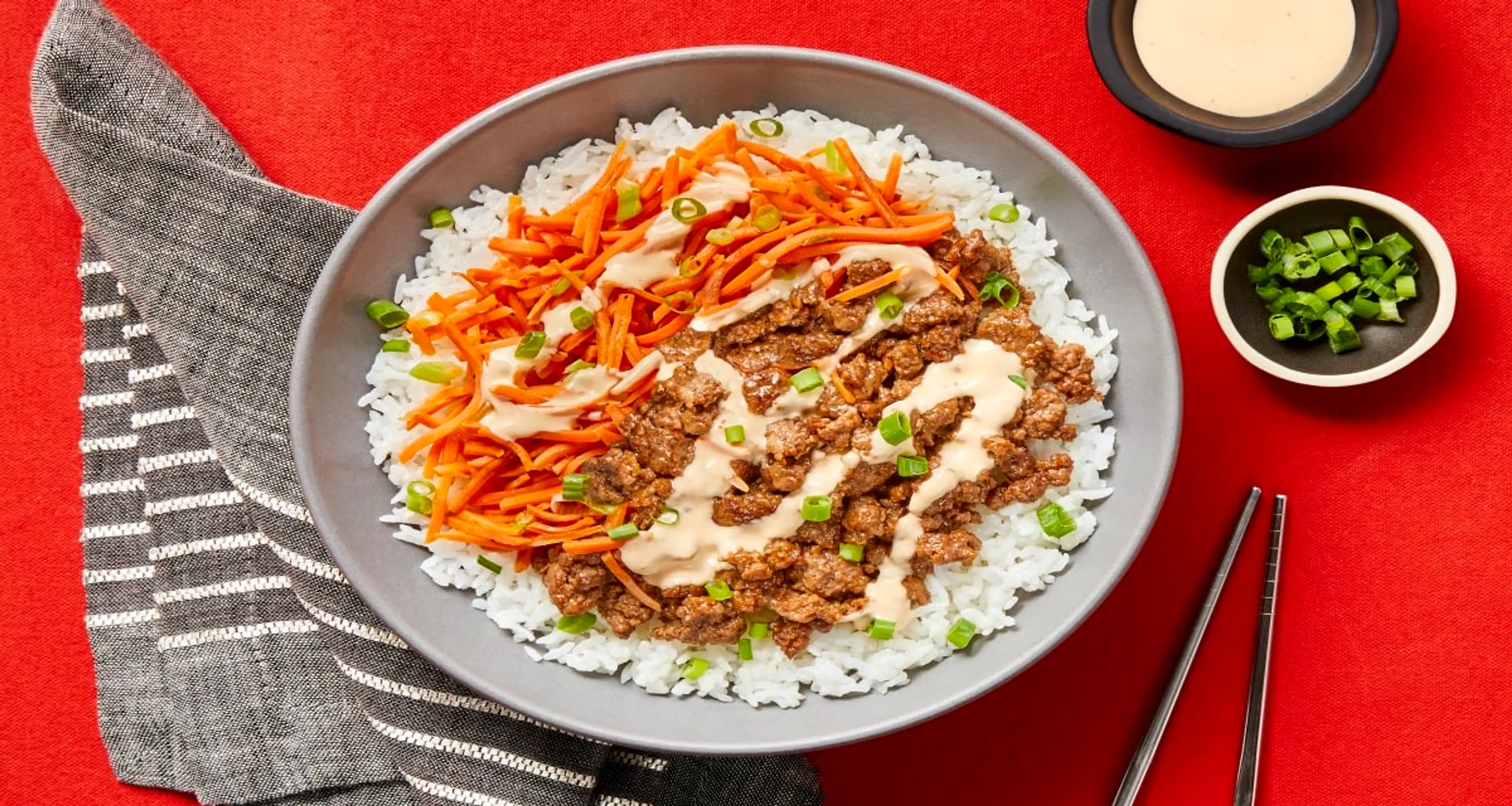 Sesame Soy Beef Bowls with Carrots, Buttery Rice & Sriracha