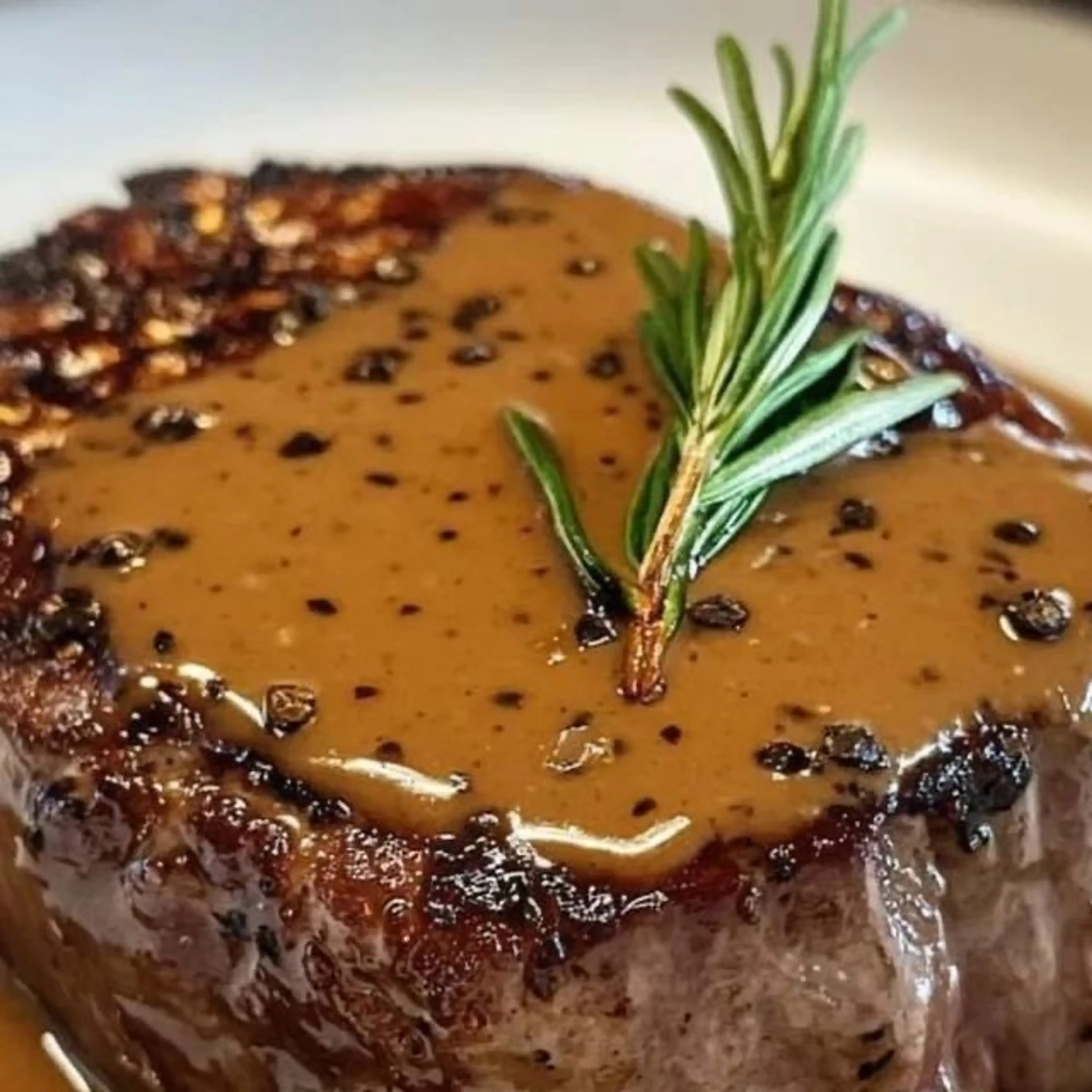 Succulent Filet Mignon Drizzled with Brandy Peppercorn Sauce