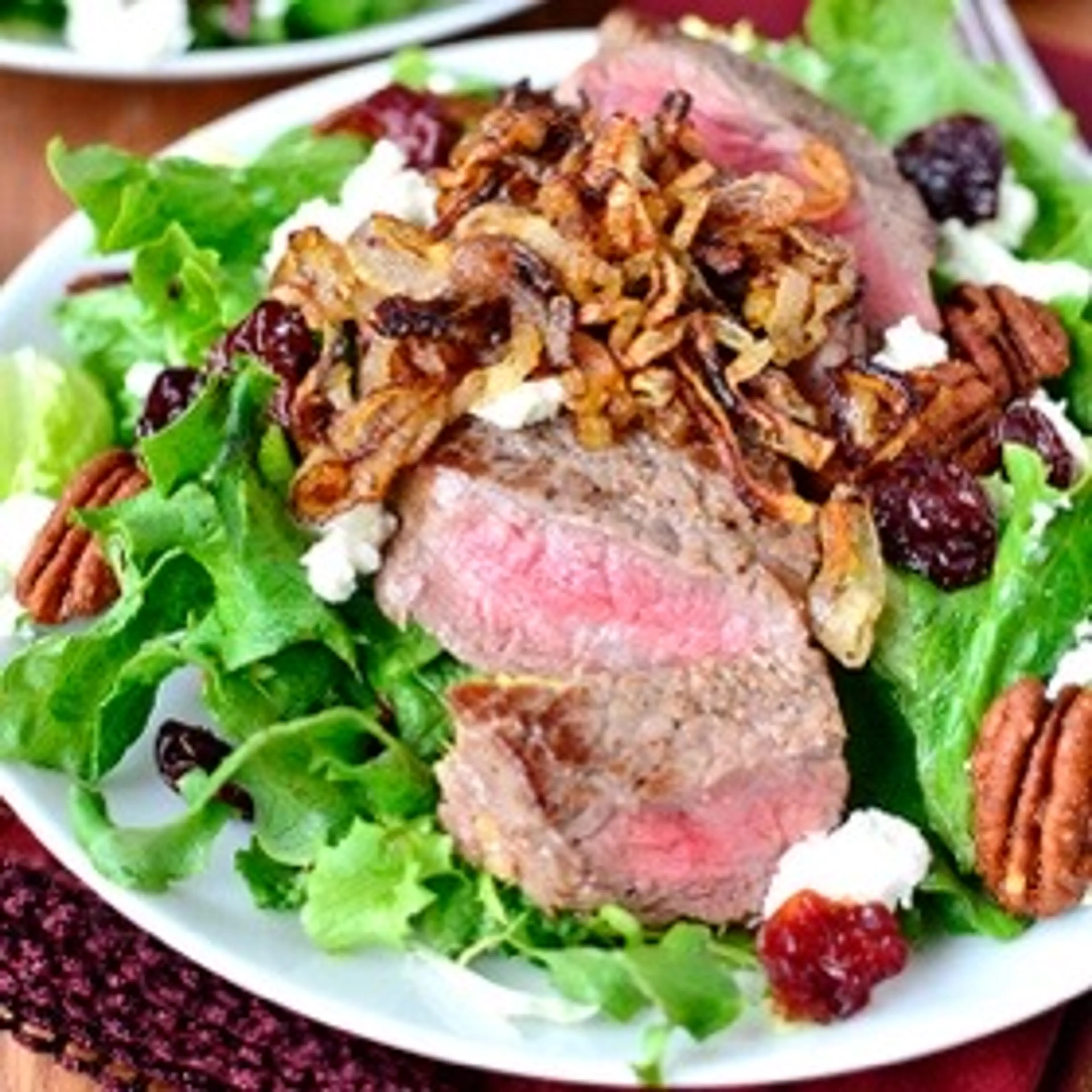 Steak Salad with Crispy Shallots, Dried Cherries, Candied Pe