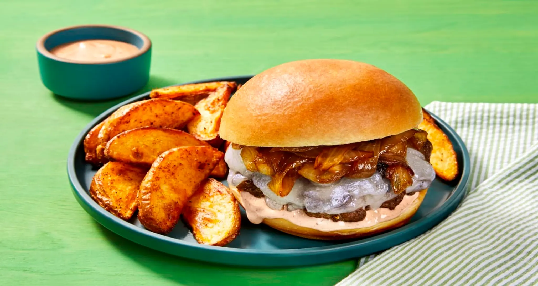 Cheesy Smashed Burgers with Old Bay Fries, Caramelized Onion