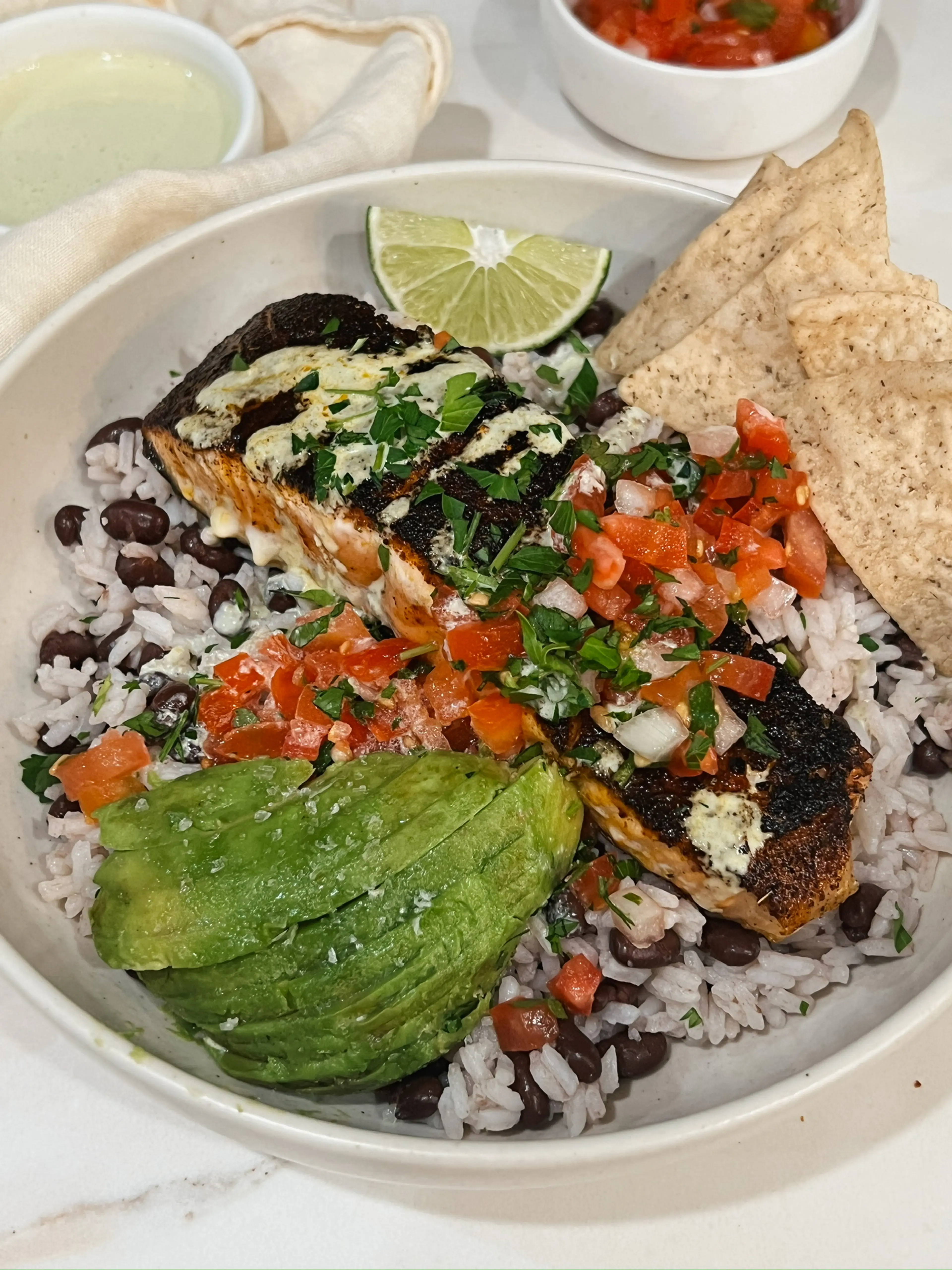 Blackened Salmon Burrito Bowls with Creamy Jalapeño Sauce