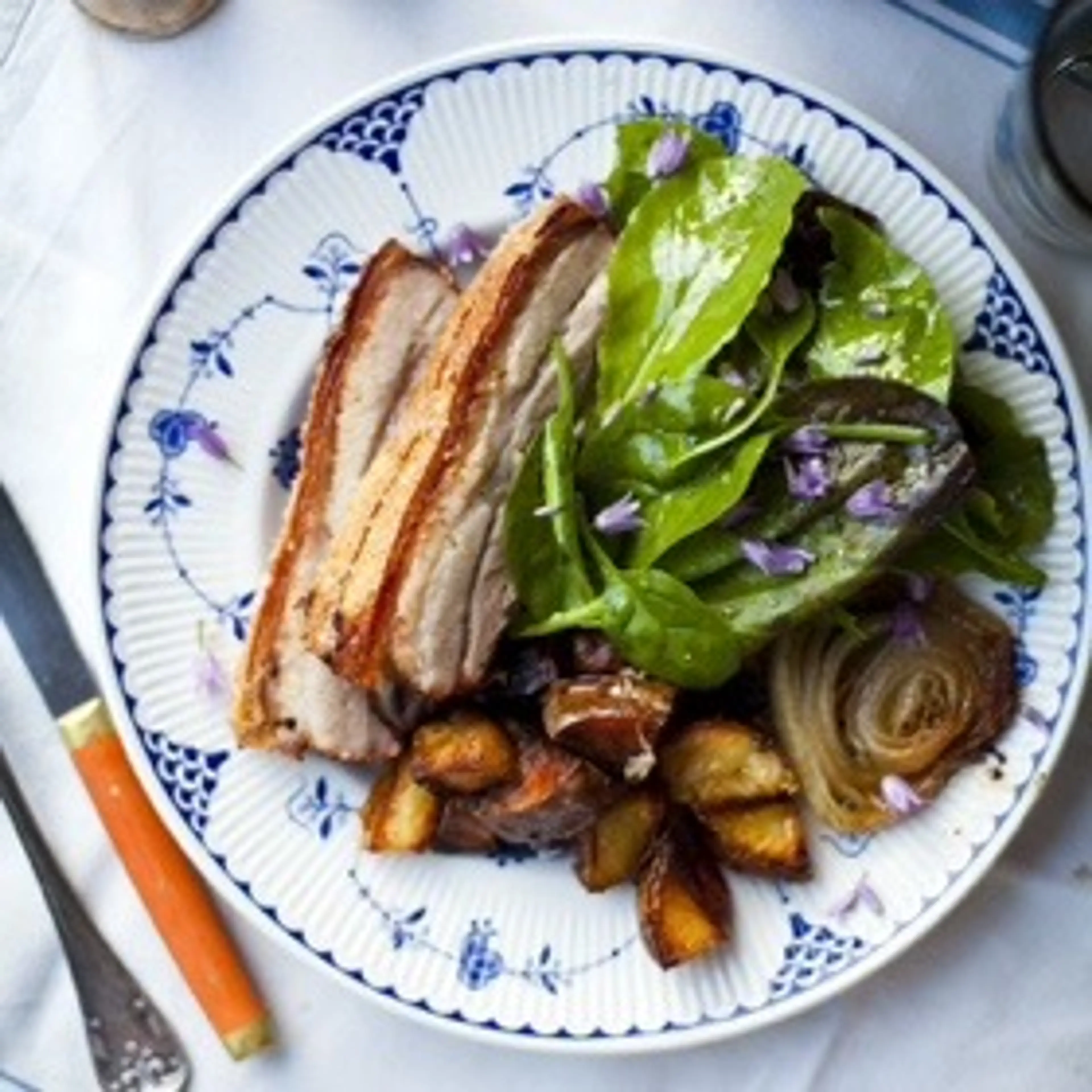 Crispy Pork Belly with Roast Potatoes and Salad Greens