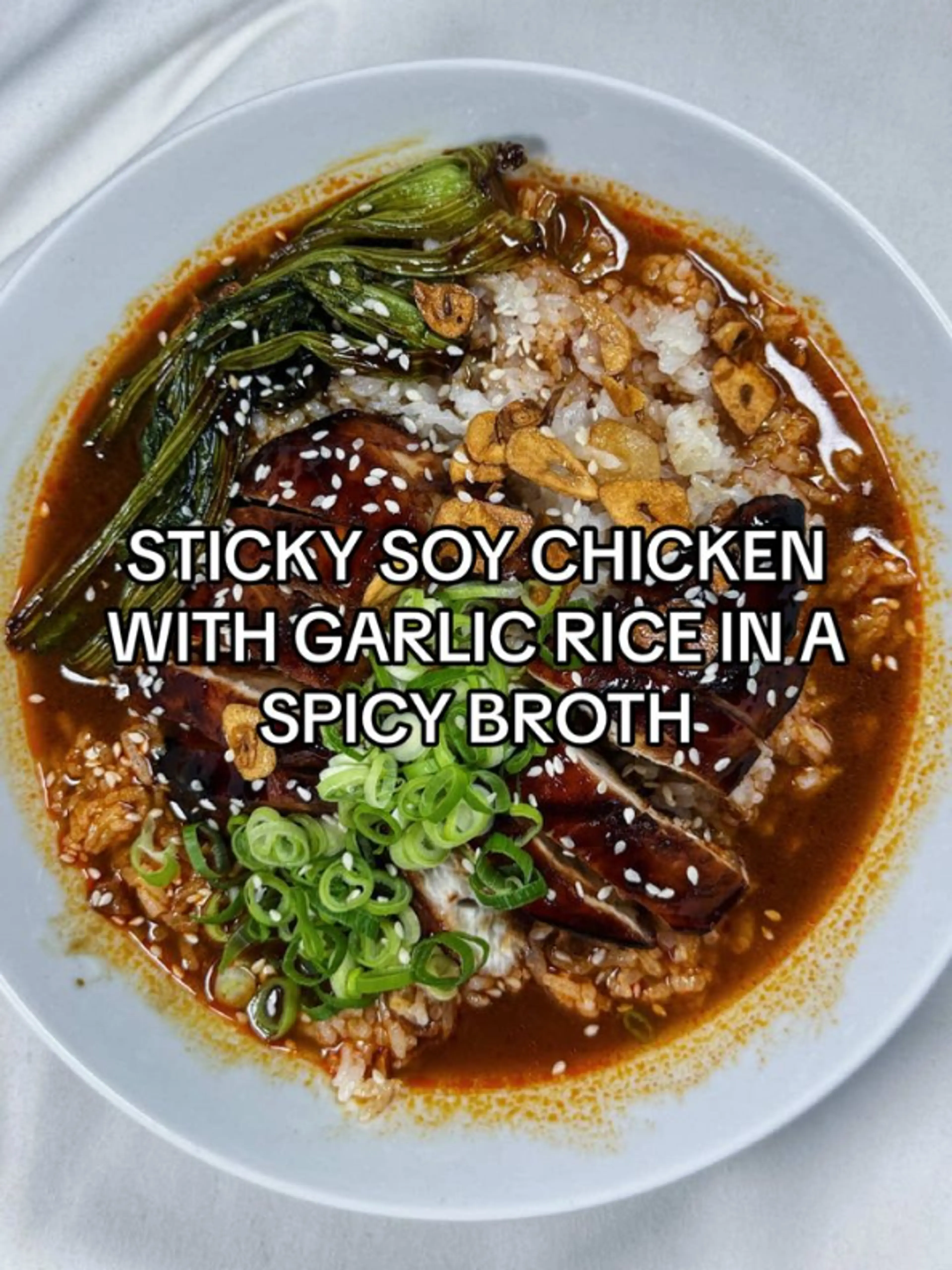 Sticky Soy Chicken with Garlic Rice in a Spicy Broth