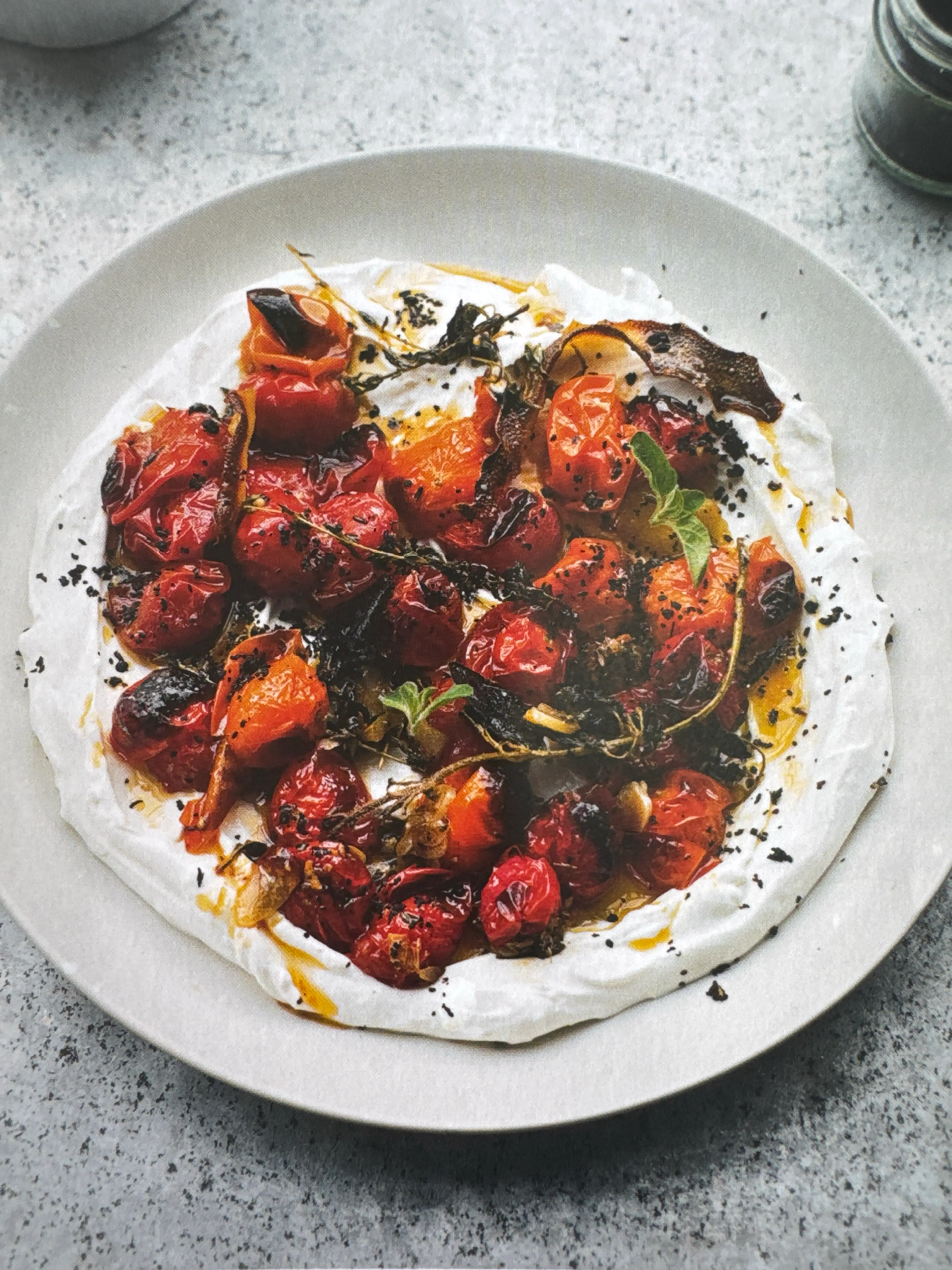 Hot charred cherry tomatoes with cold yoghurt