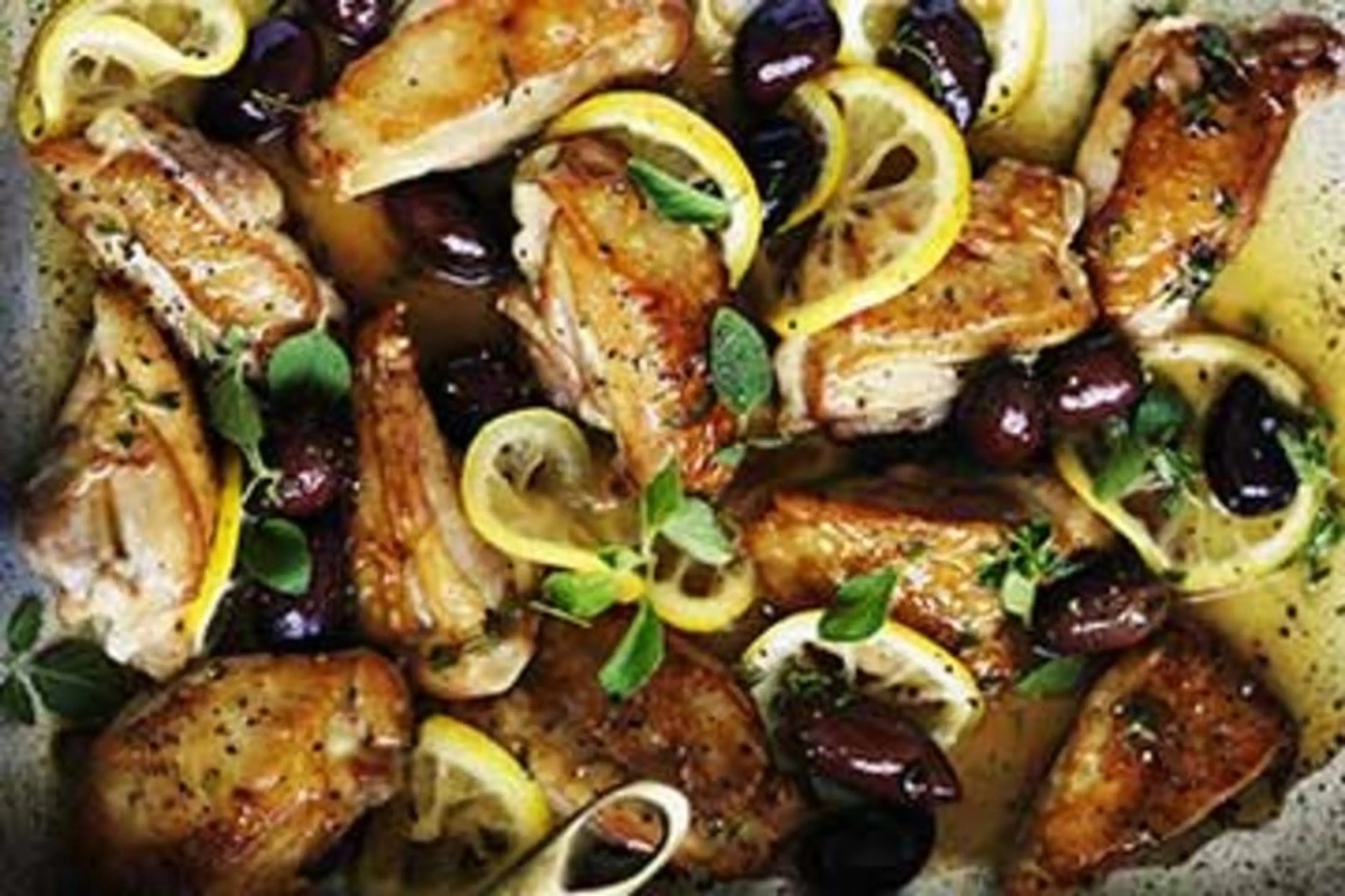 Braised chicken with lemon, oregano and olives