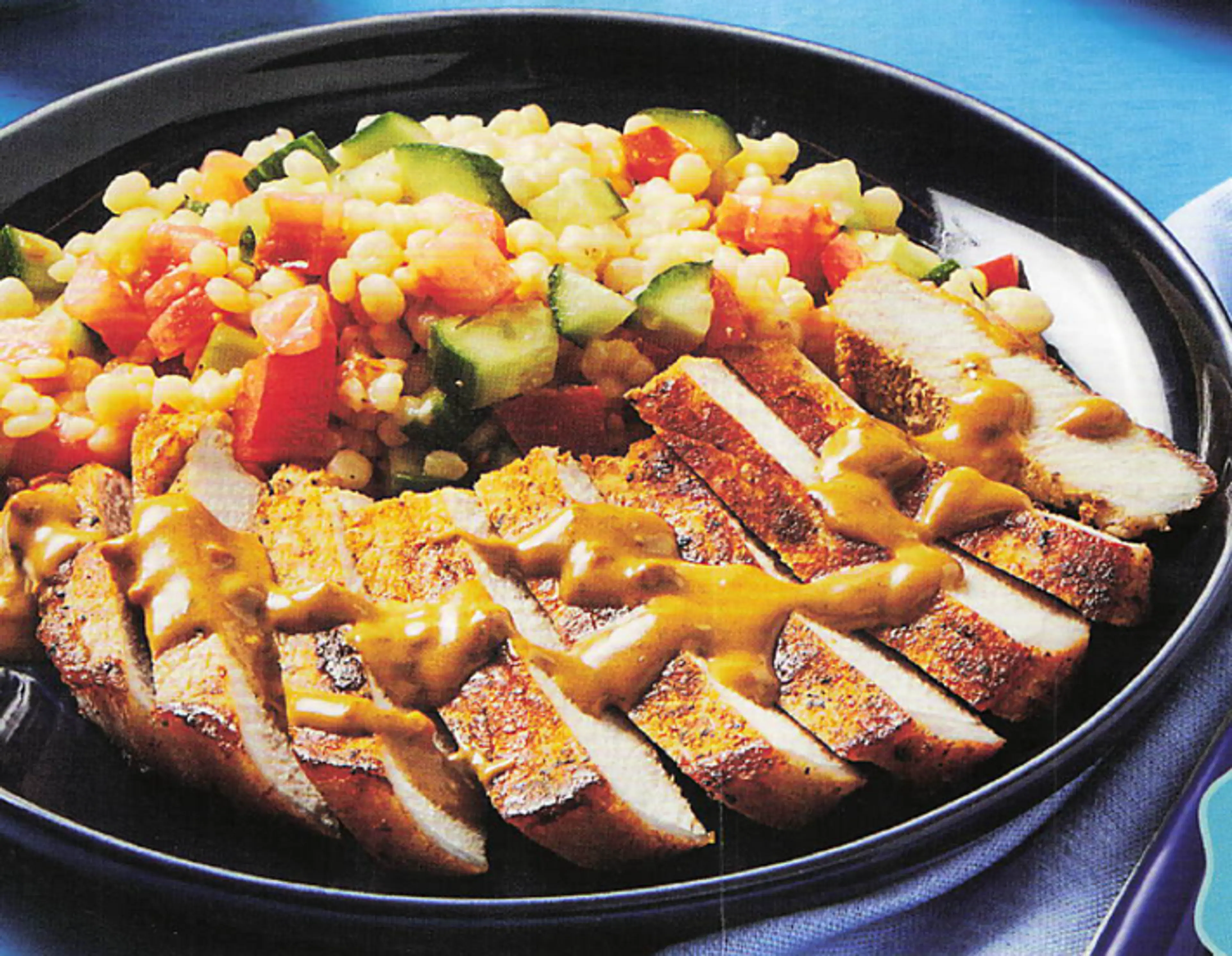 GREEK TAVERNA PORK CHOPS with Cucumber-Tomato Couscous Salad