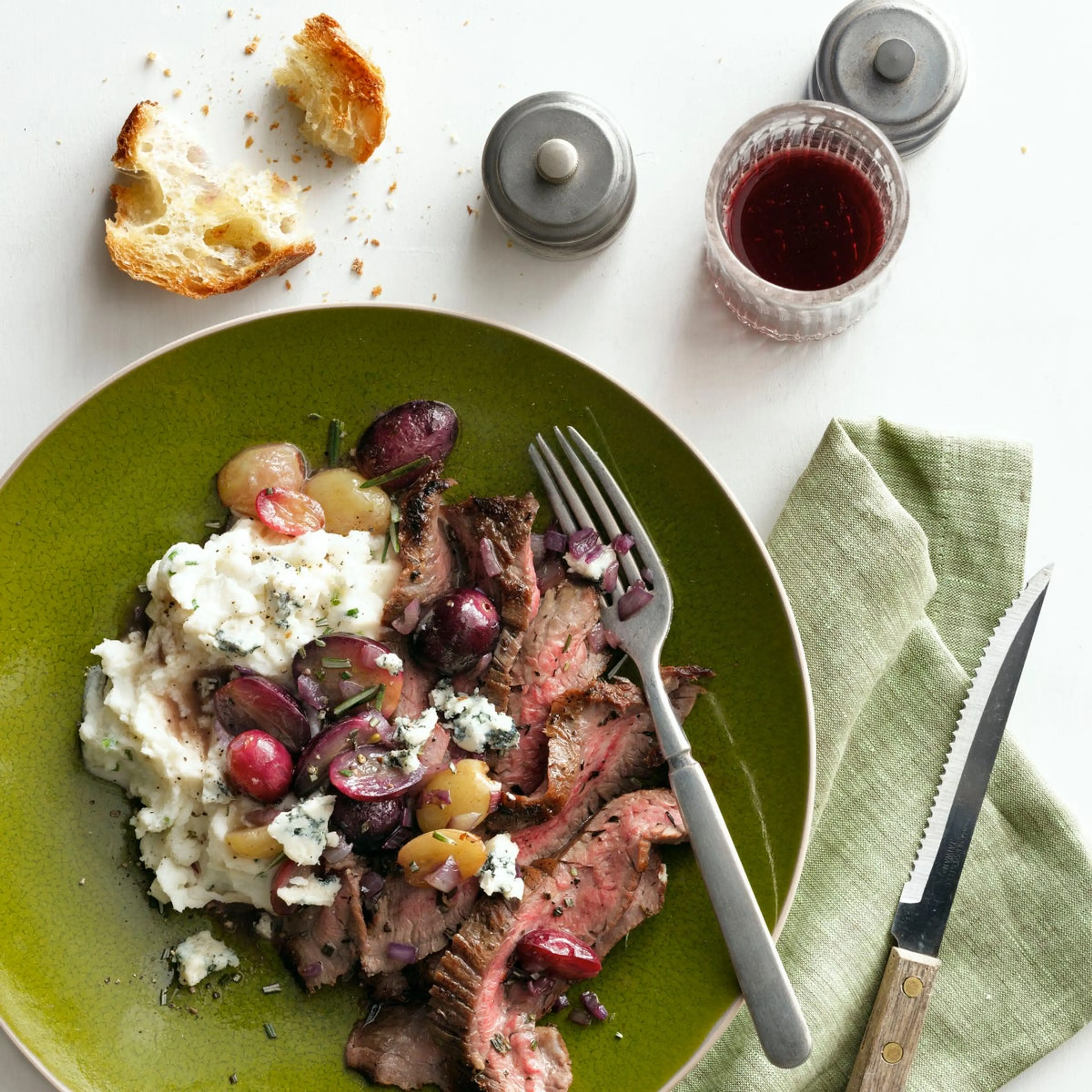 Herb-Garlic Crusted Flank Steak with Pan-Roasted Grapes