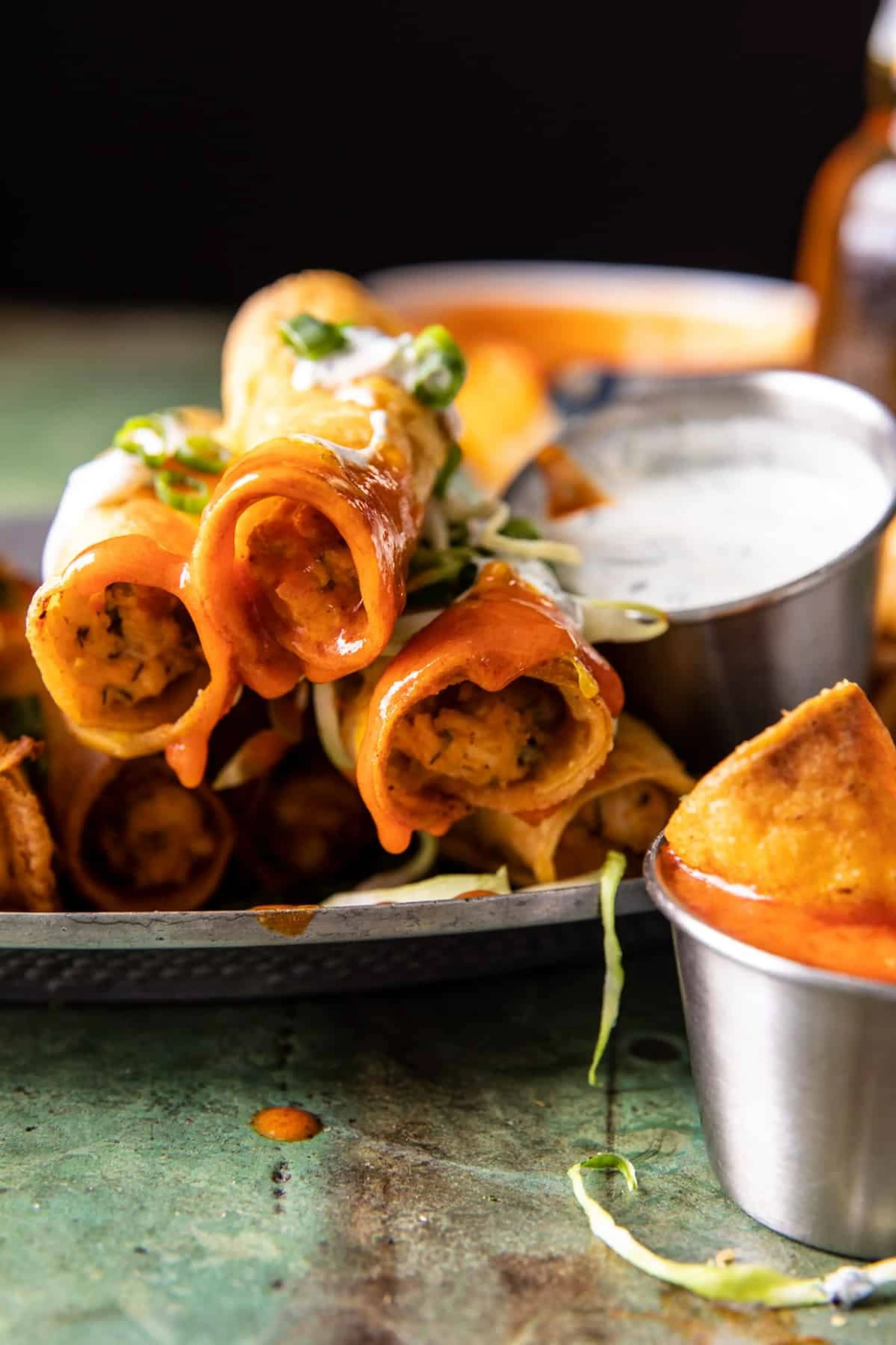 Jalapeño Cream Cheese Chicken Taquitos with Buffalo Sauce