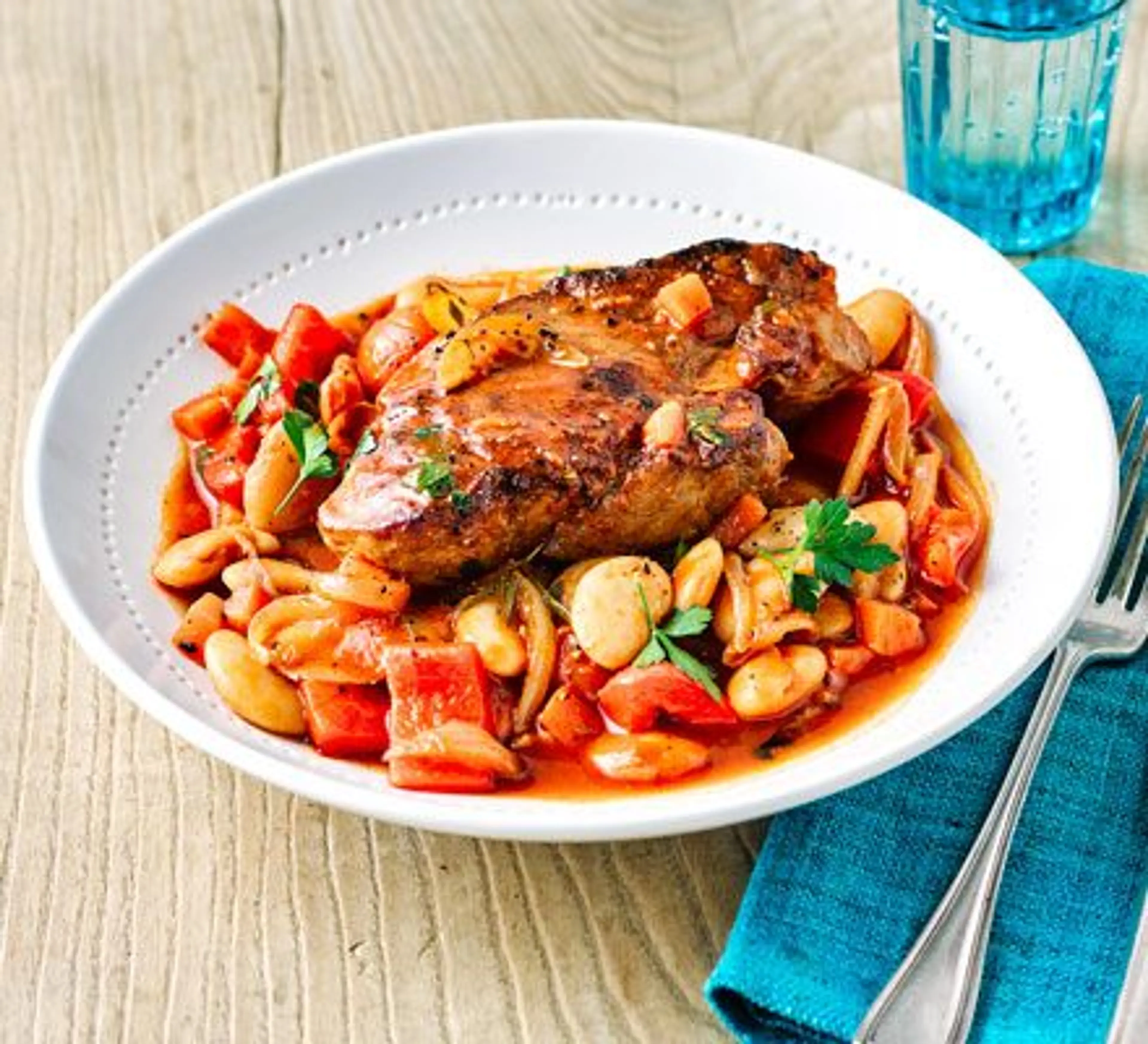 Spanish pork shoulder steaks with beans