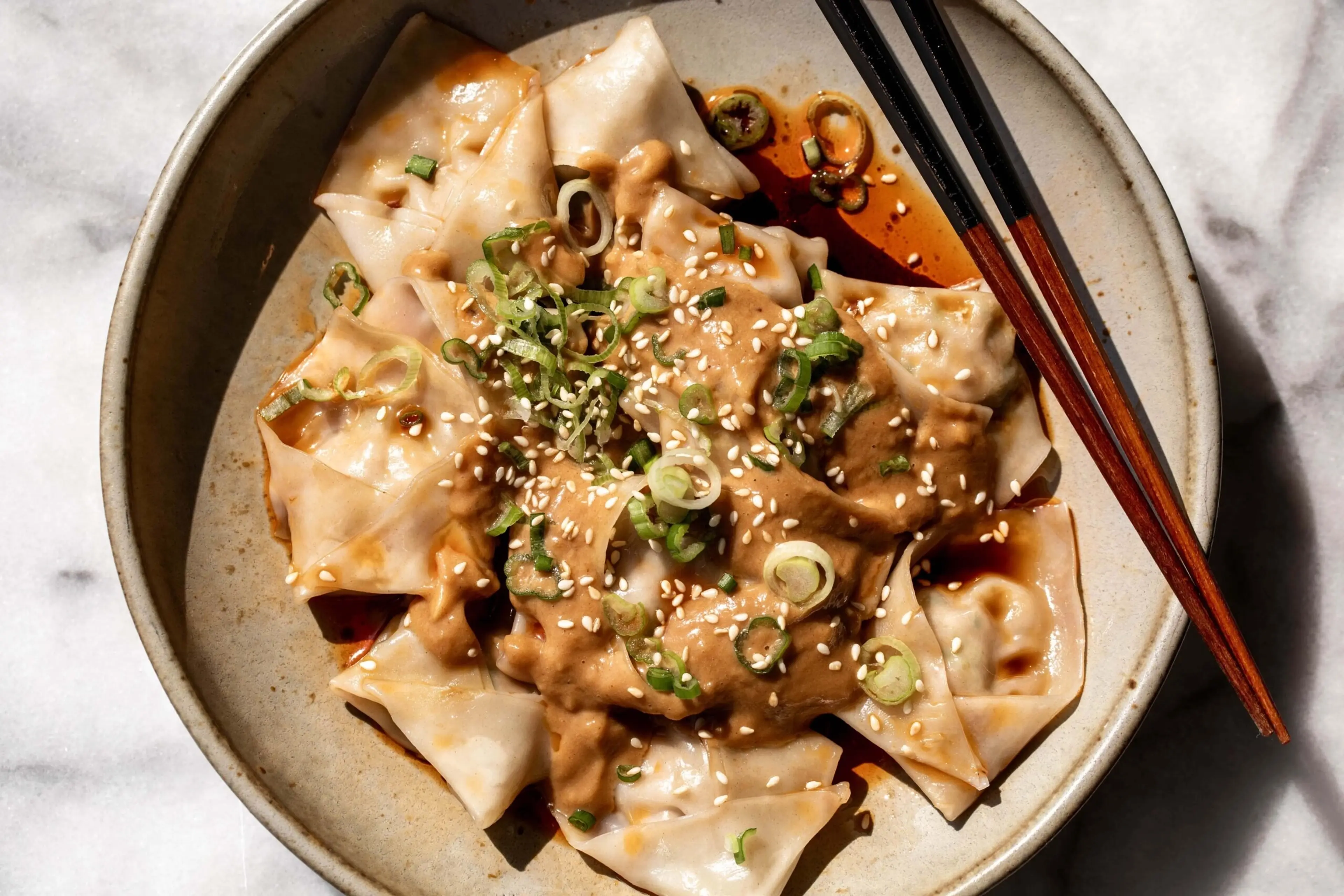Pork Wontons with Peanut Sauce and Chili Oil